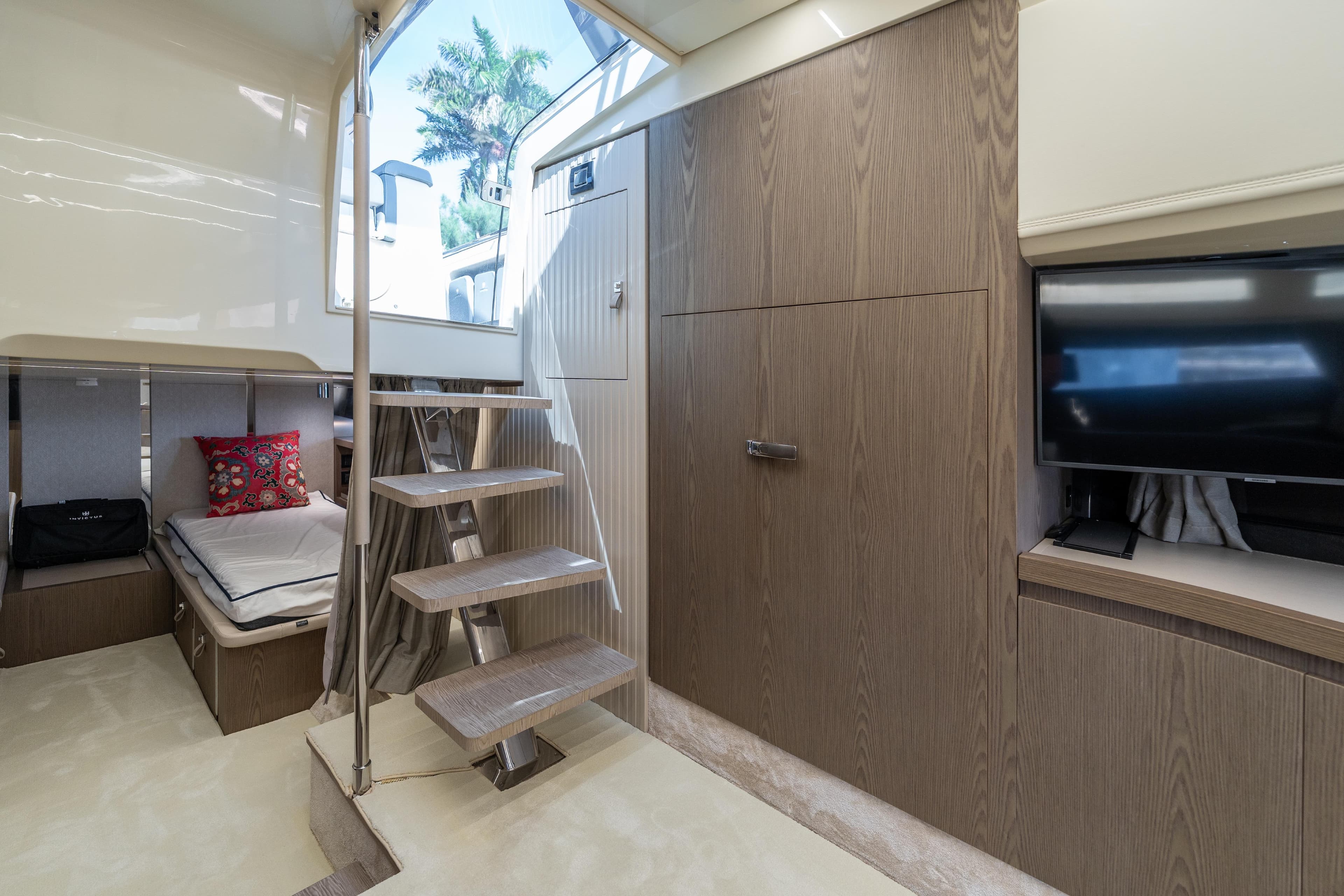 Luxurious interior of 2024 Invictus TT460 yacht with modern design and wooden finishes.