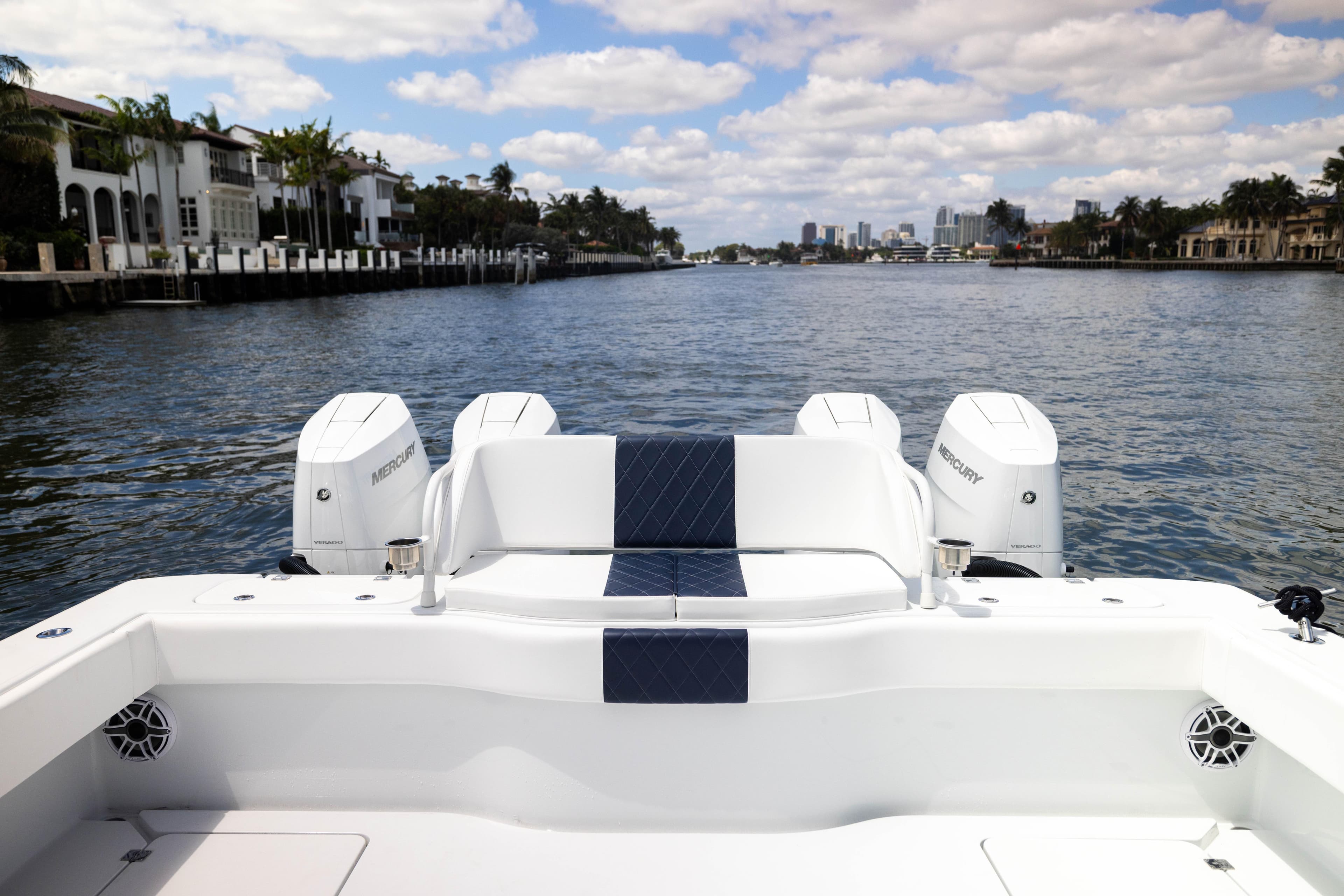Freeman 47 LX 2026 boat with Mercury engines on a scenic waterway.