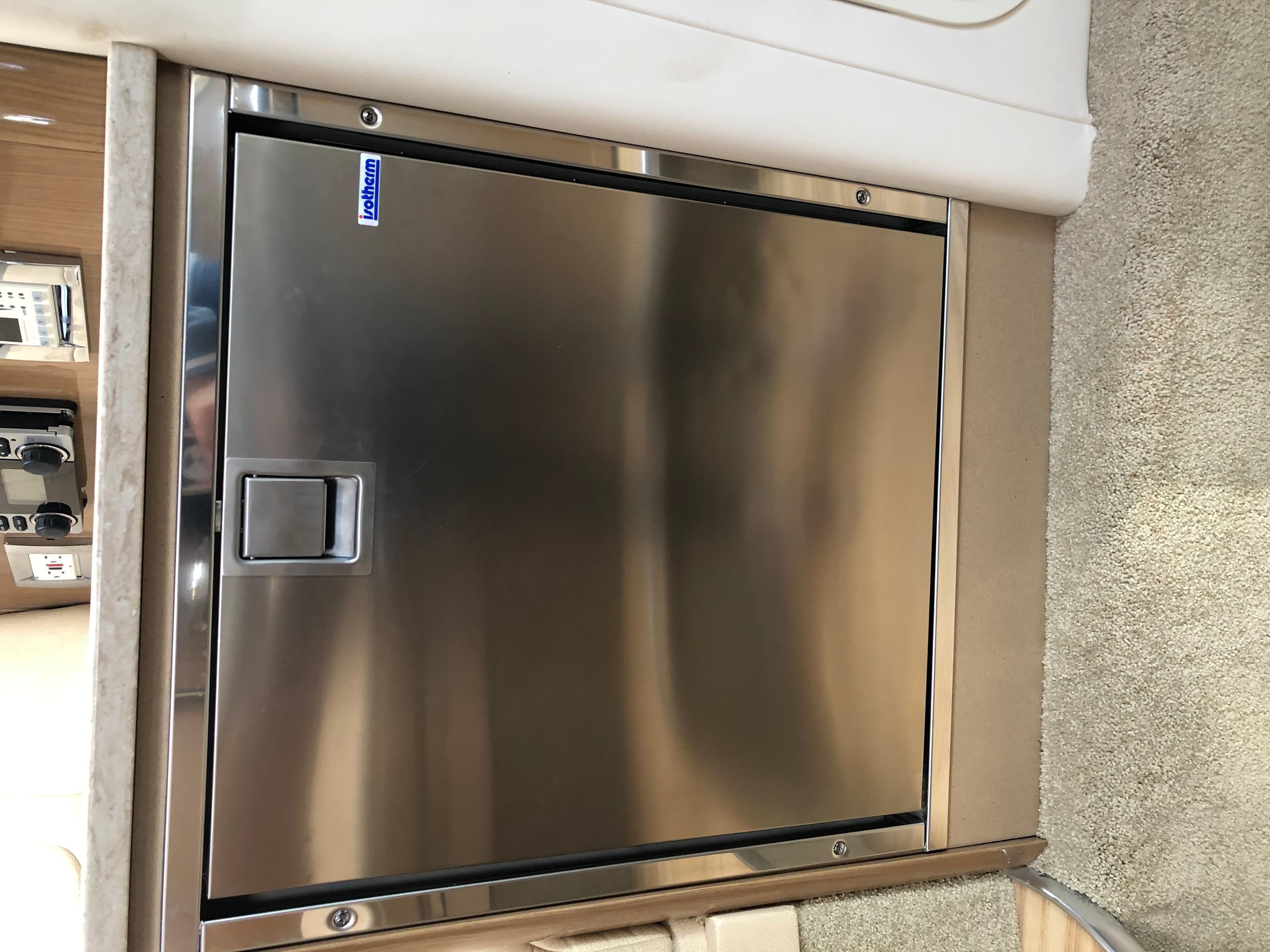 Stainless steel refrigerator in 2013 Formula 350 Sun Sport boat interior.