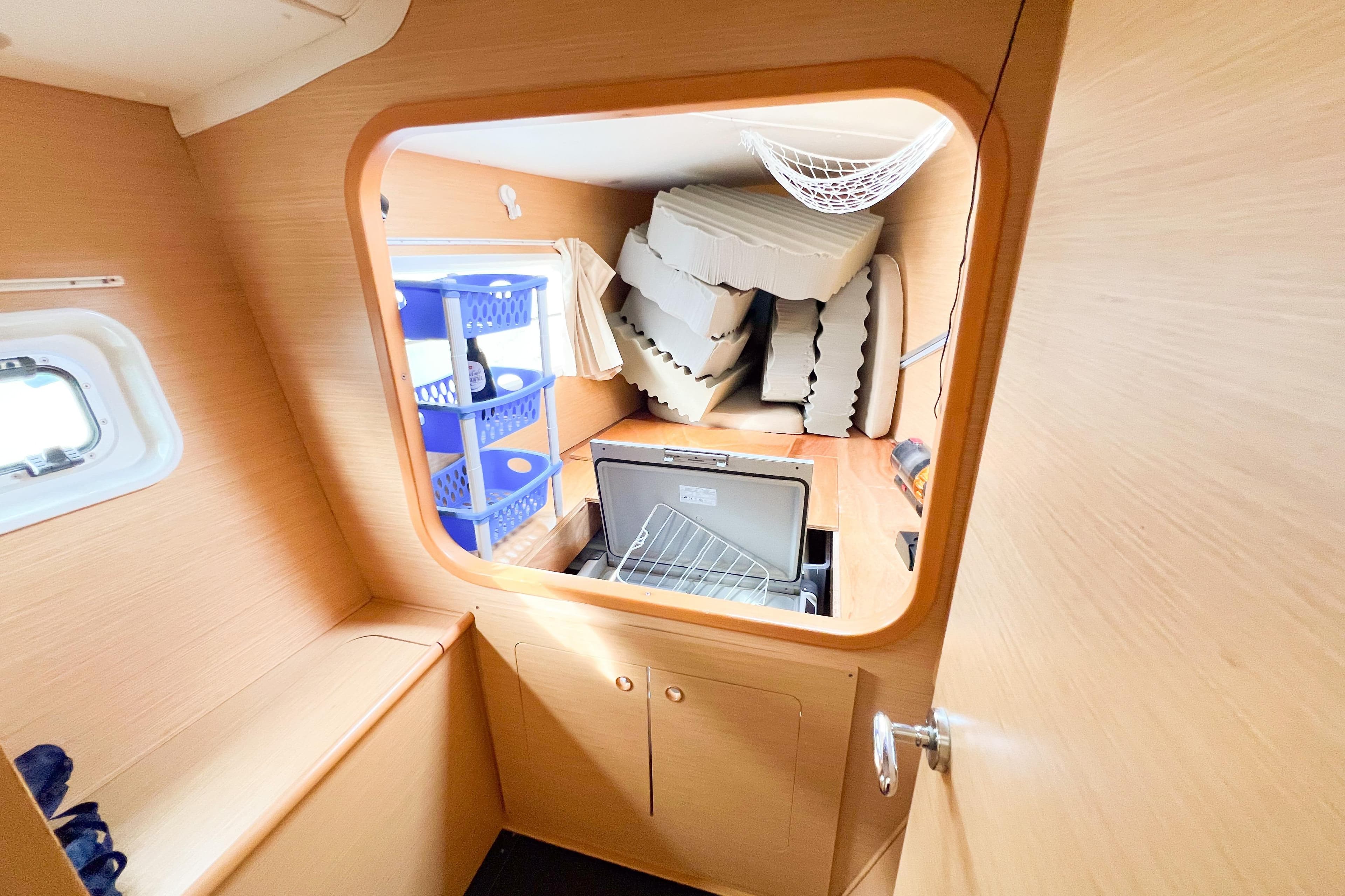 Interior of 2008 Lagoon 380 S2 yacht with storage and cushions.