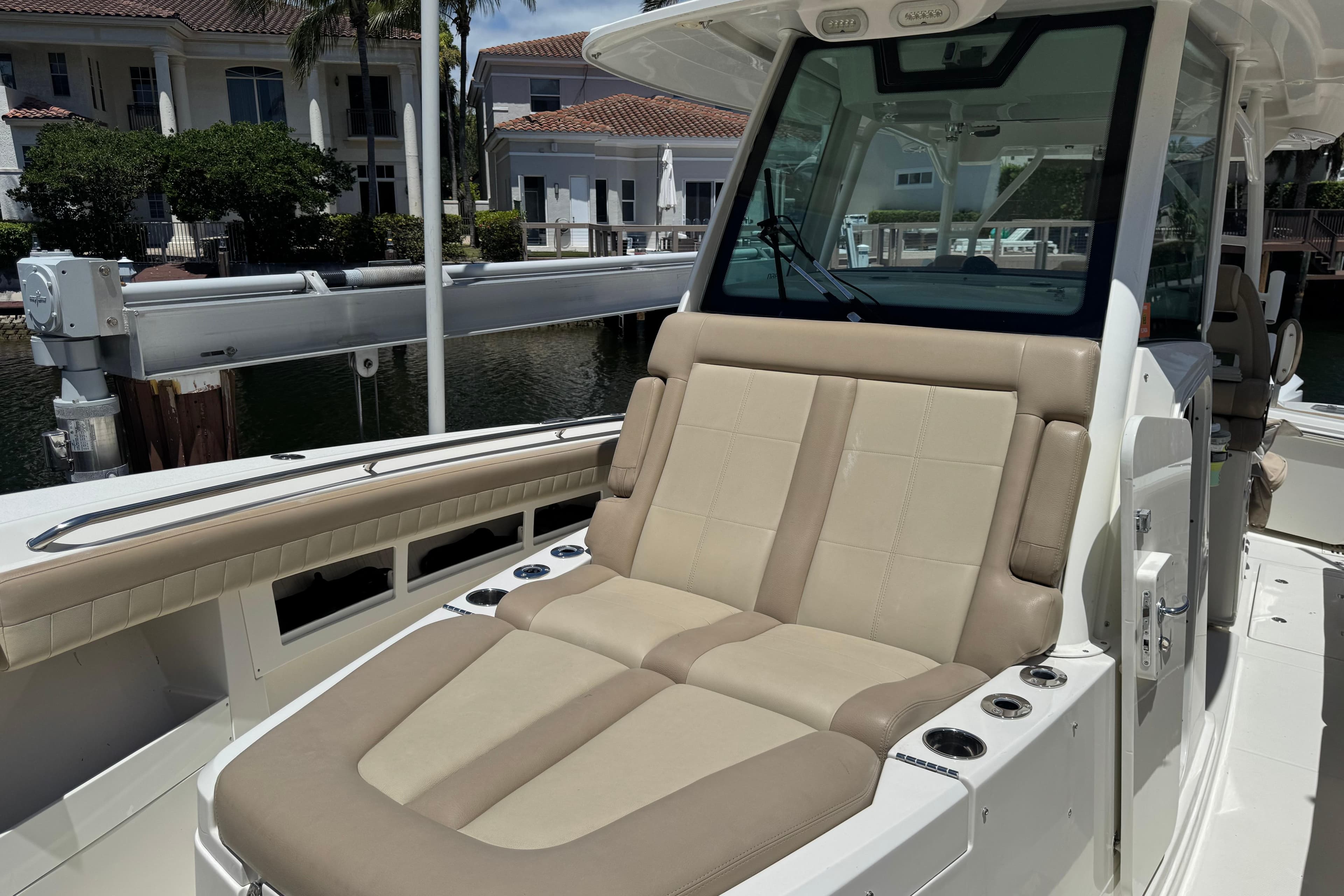 2019 Sailfish 360 CC boat with beige seating and modern console design.