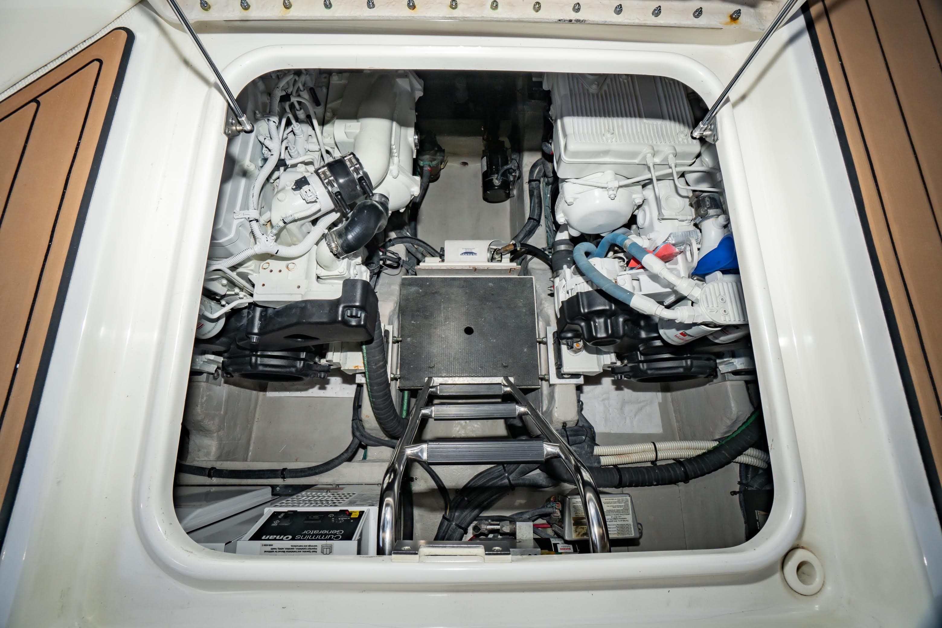 Engine compartment of a 2017 Sea Ray Sundancer 460 yacht, showcasing mechanical components.
