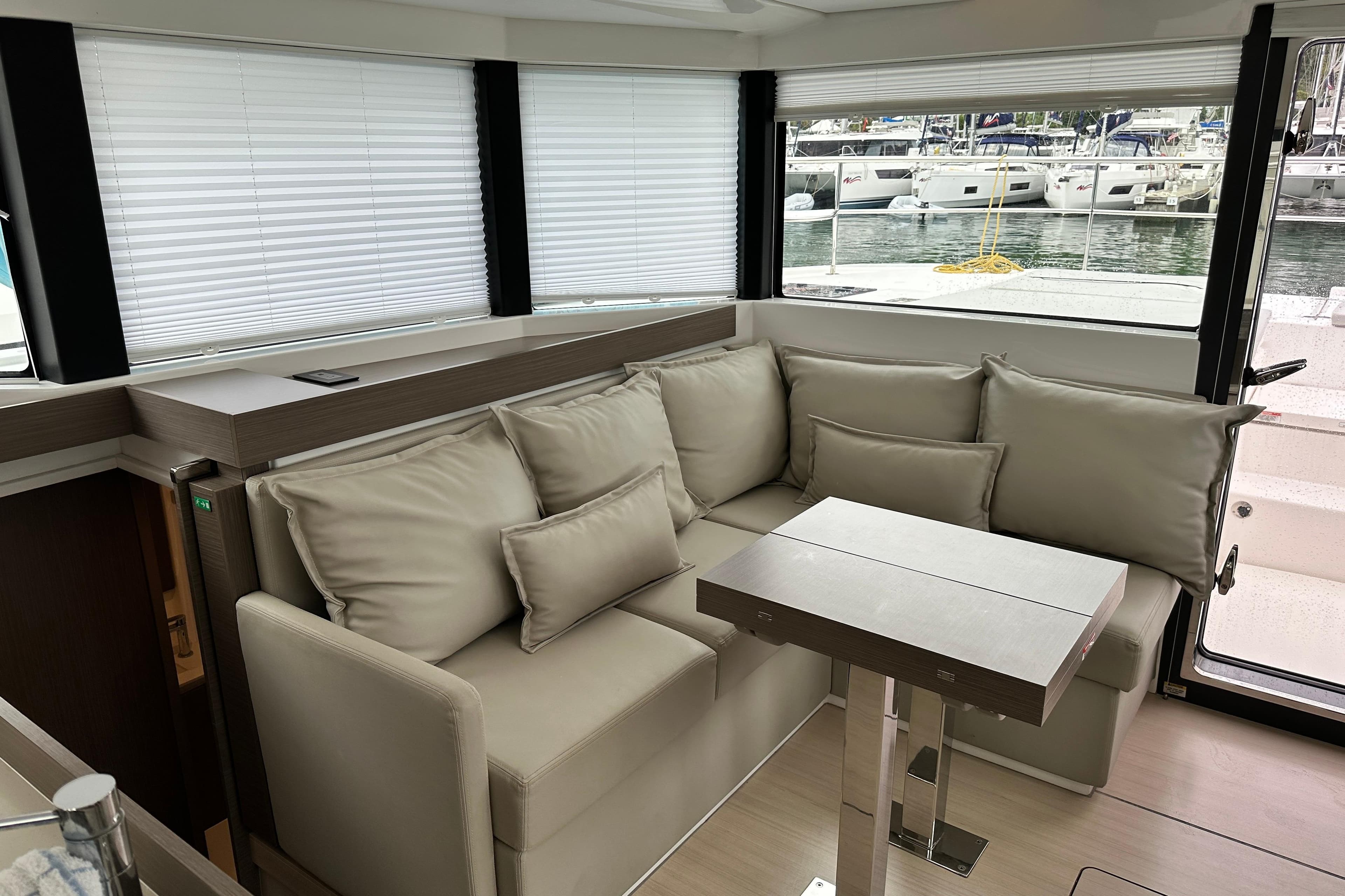 Interior of 2025 Robertson and Caine Leopard 40 Powercat with modern seating and table.