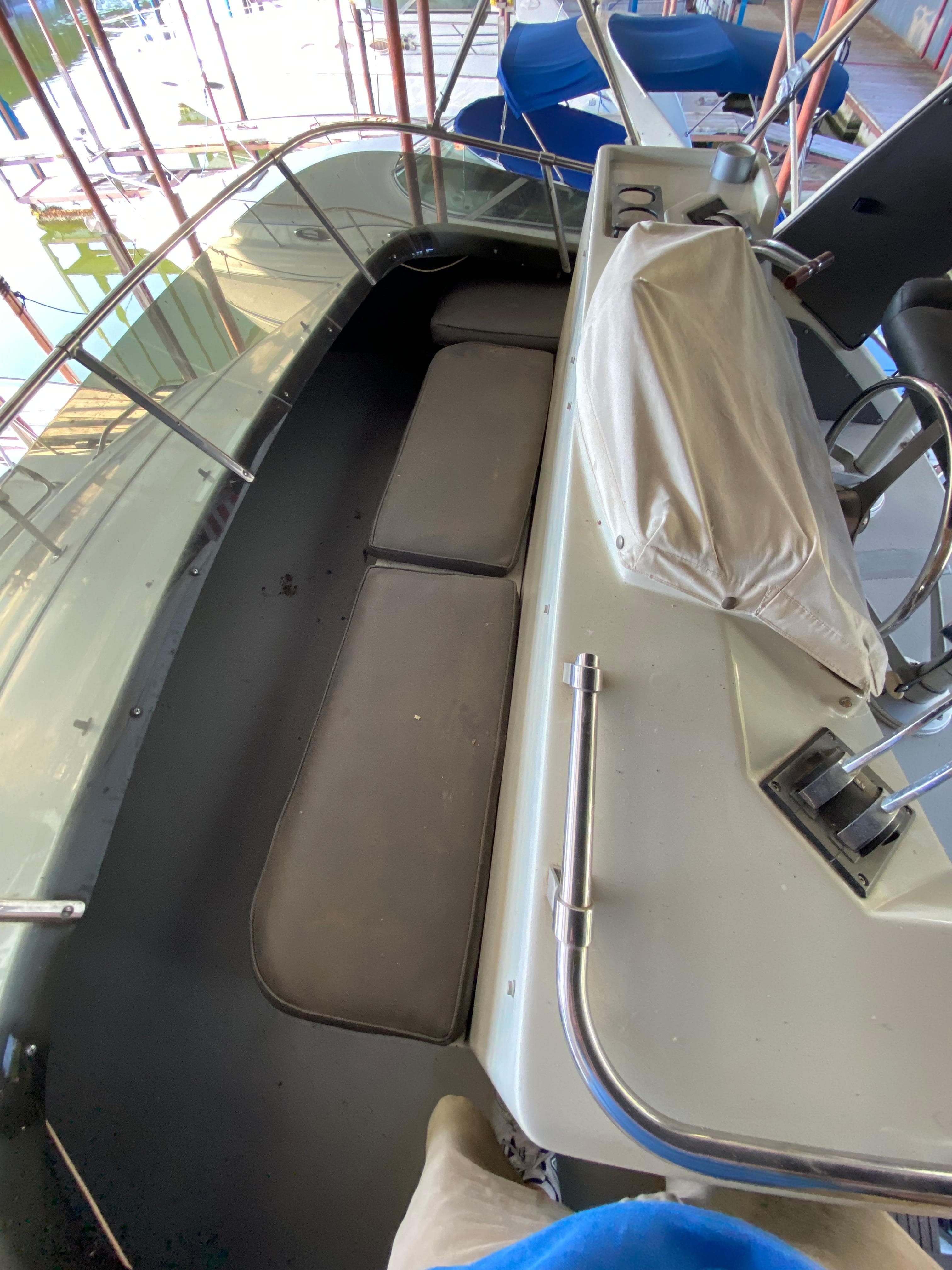1984 Trojan 10 Meter Sedan boat interior with seating and control panel.