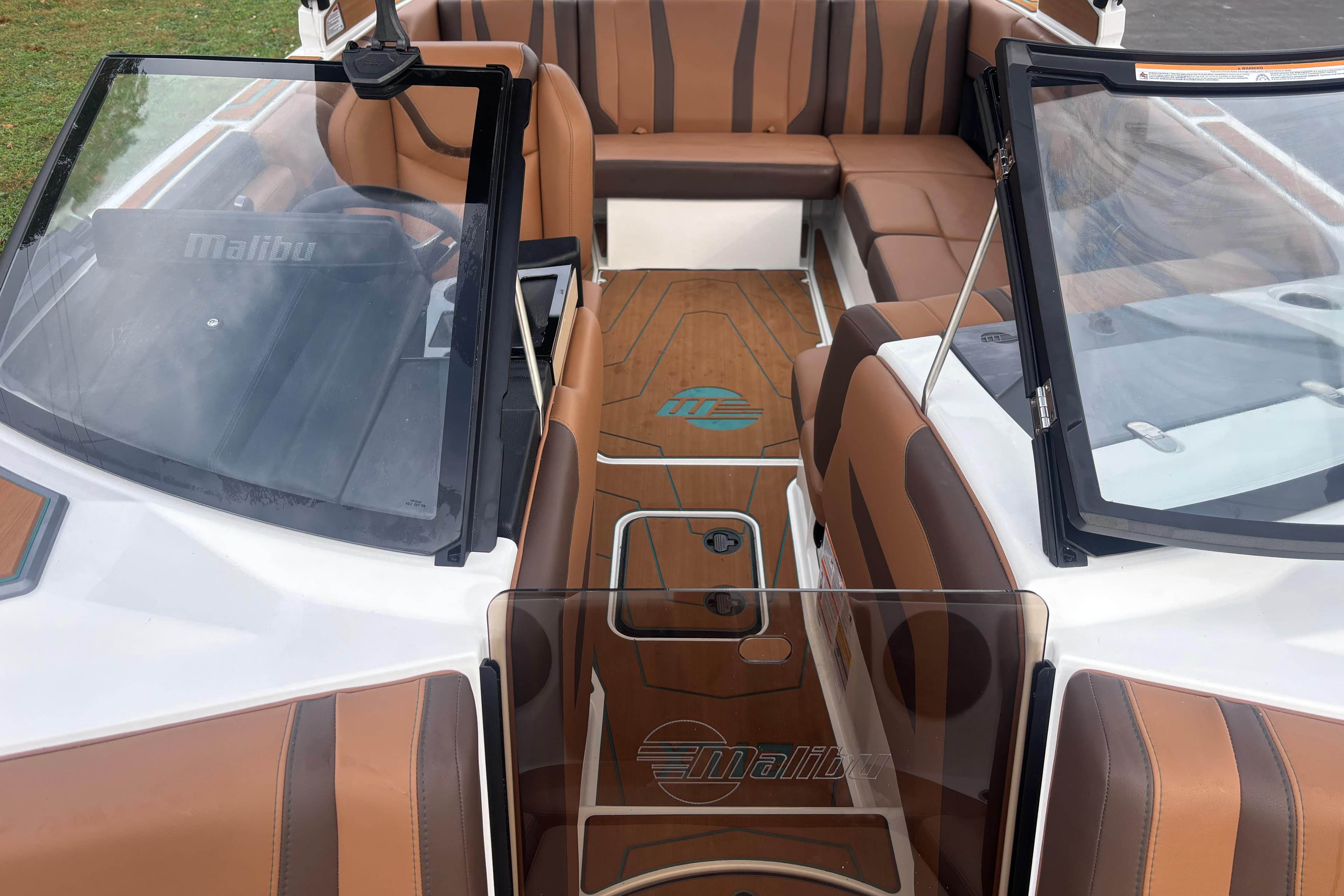 2026 Malibu Wakesetter 21 LX interior with brown seating and sleek design.