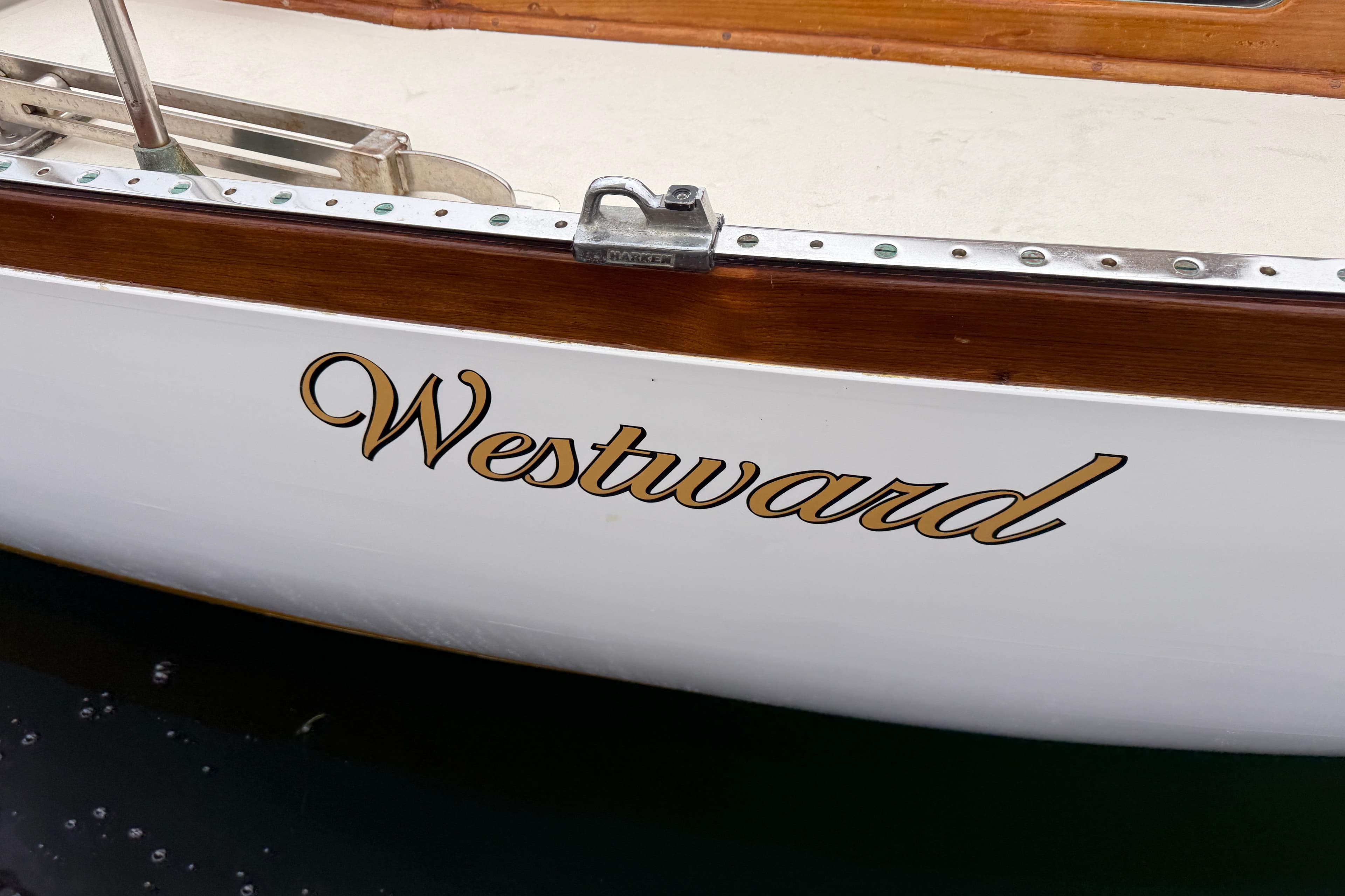 1962 Lapworth Sloop named "Westward" with elegant wooden trim.