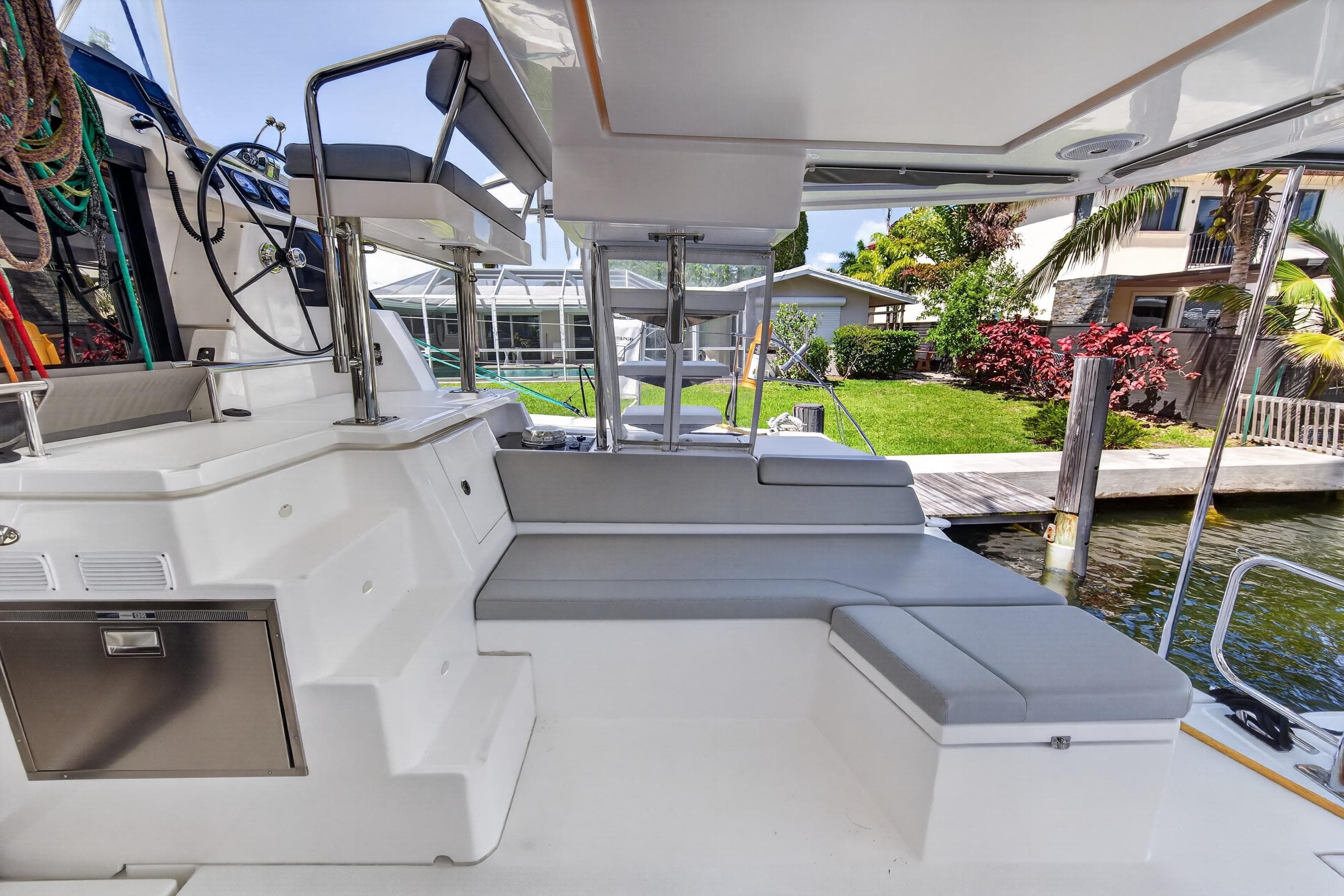 Leopard 50 yacht interior, 2022 model, featuring sleek seating and modern design by the water.