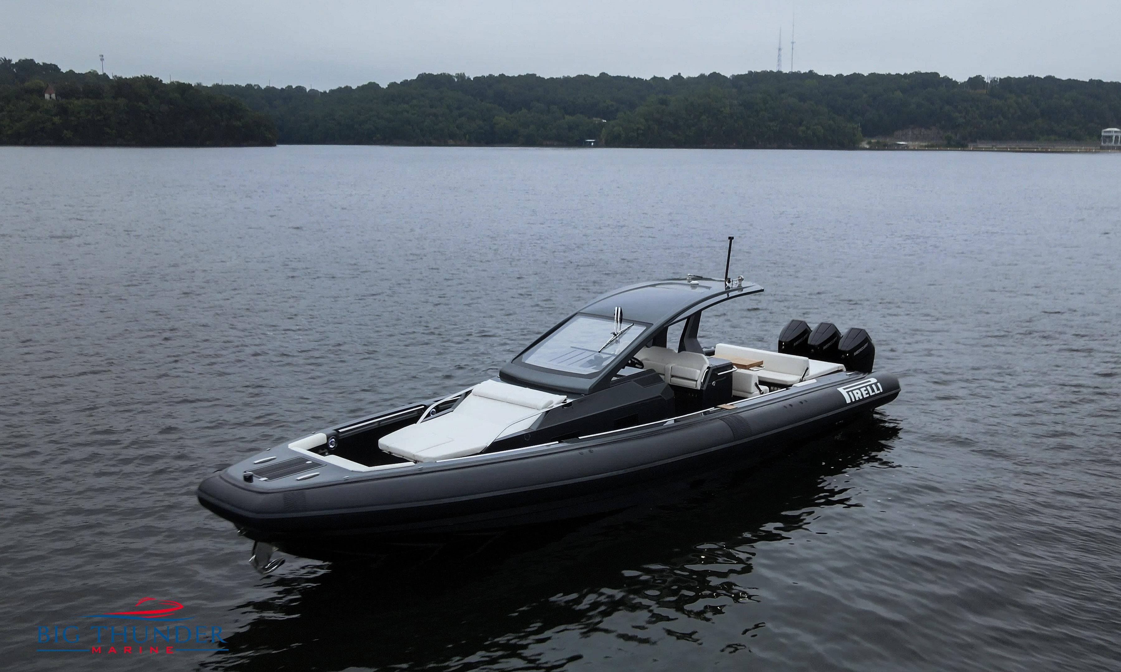 2025 Pirelli TecnoRib 42 OB boat on calm lake waters.