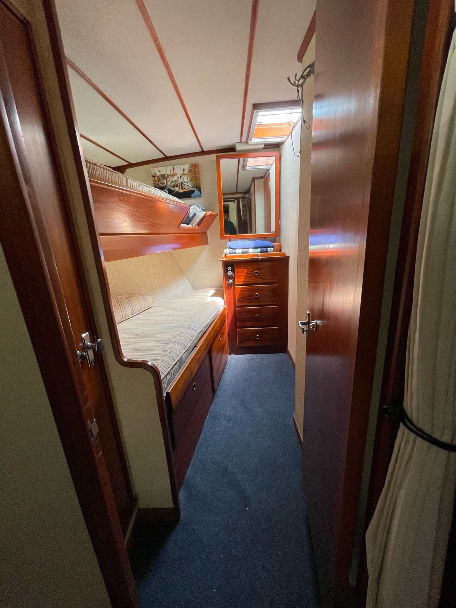 Interior of 1977 Alden Boothbay Explorer with wooden furnishings.