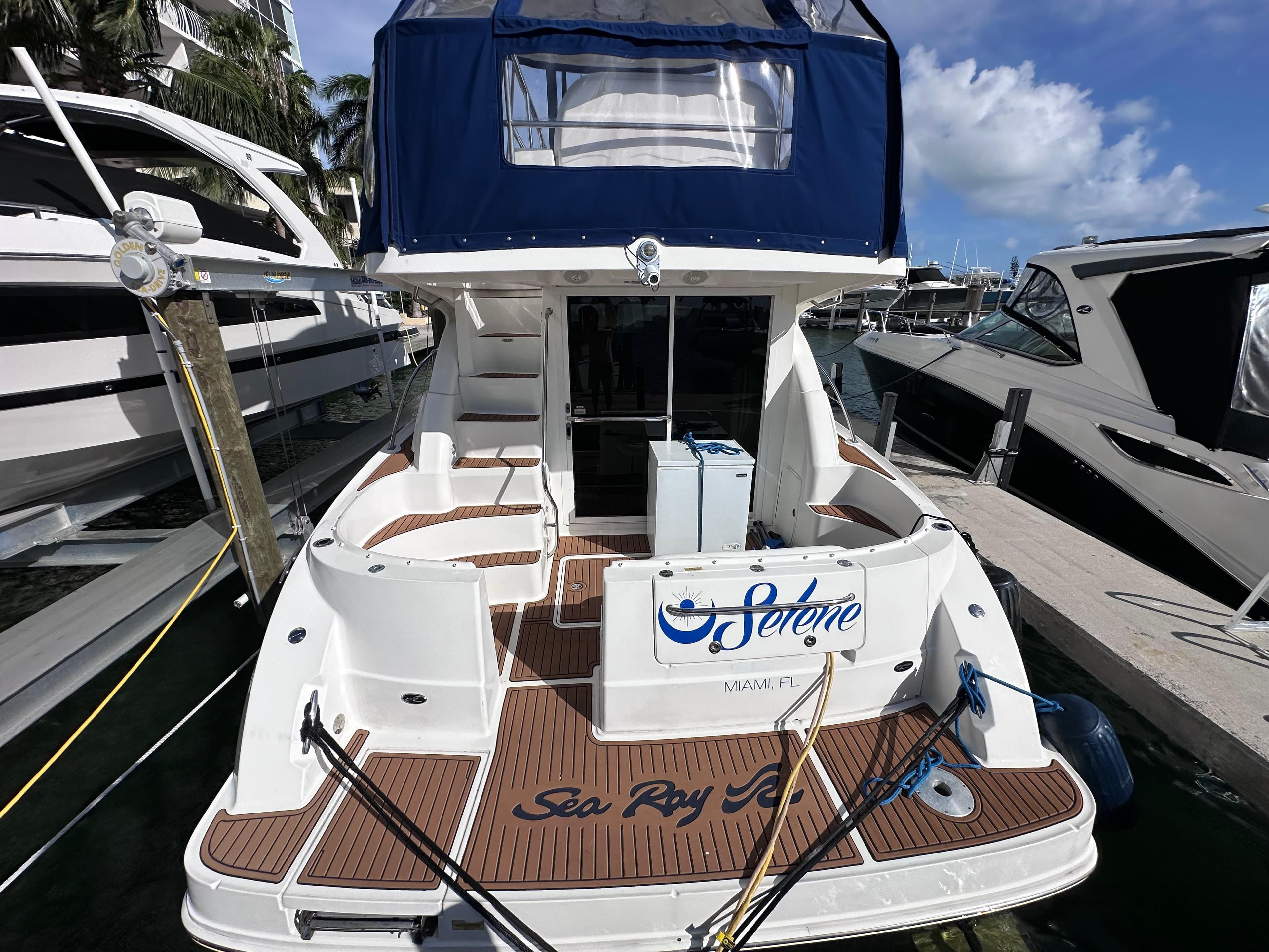 2007 Sea Ray 36 Sedan Bridge yacht docked at marina.