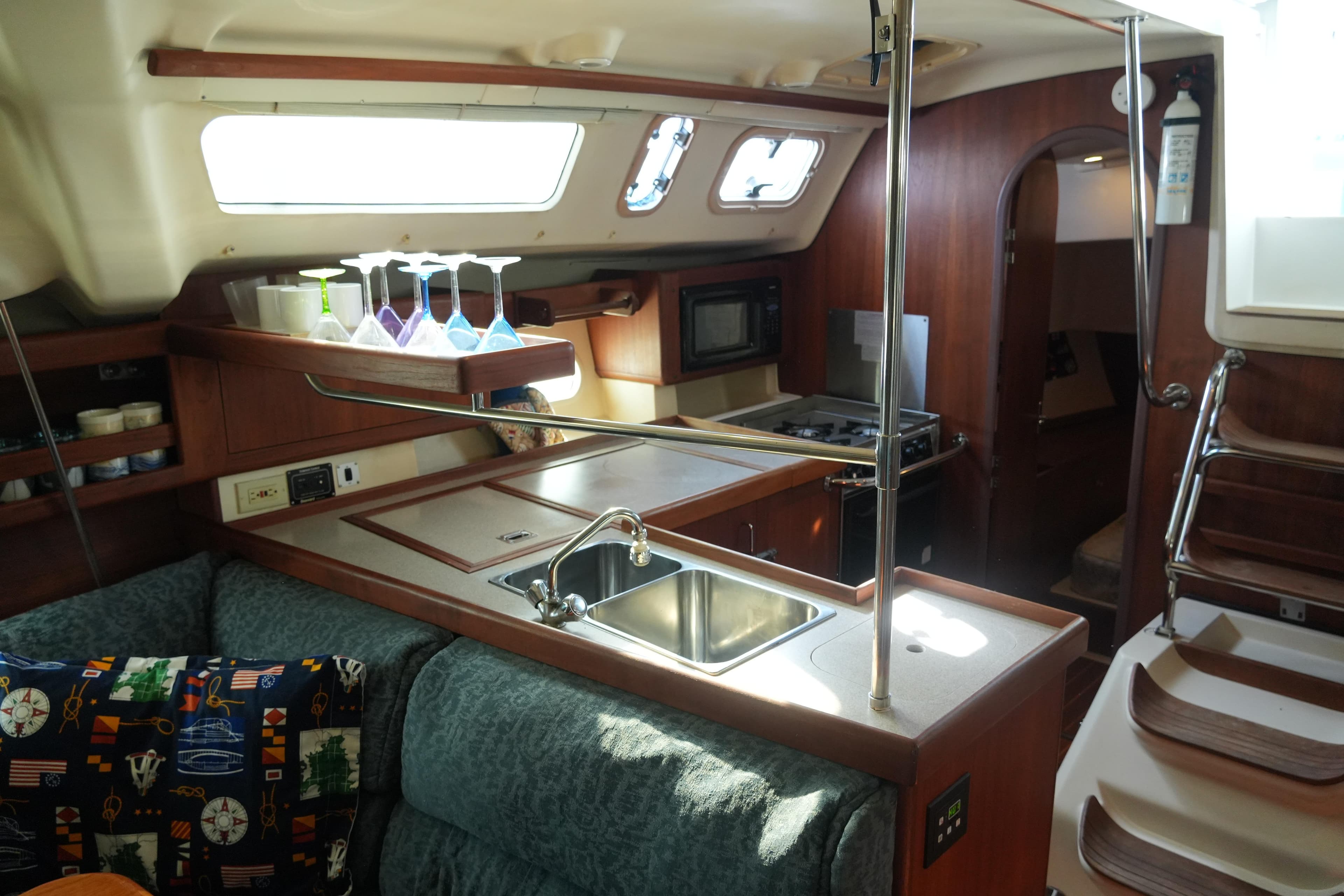Interior of 1998 Hunter 410 sailboat with kitchen and seating area.