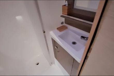 2019 Fountaine Pajot SABA 50 yacht bathroom with modern sink and storage.