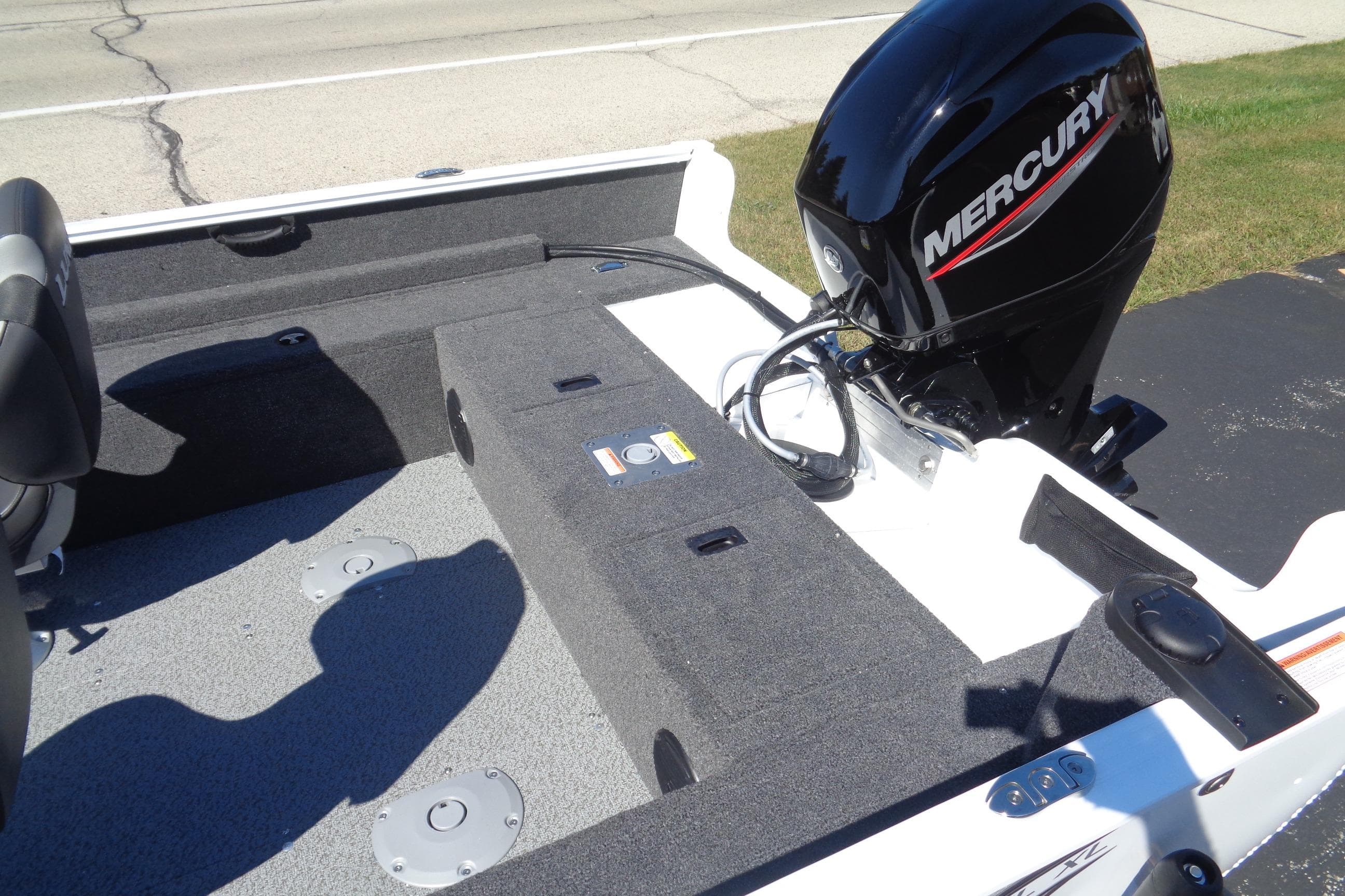 2026 Lund 1650 Rebel XL SS boat with Mercury outboard motor, interior view.