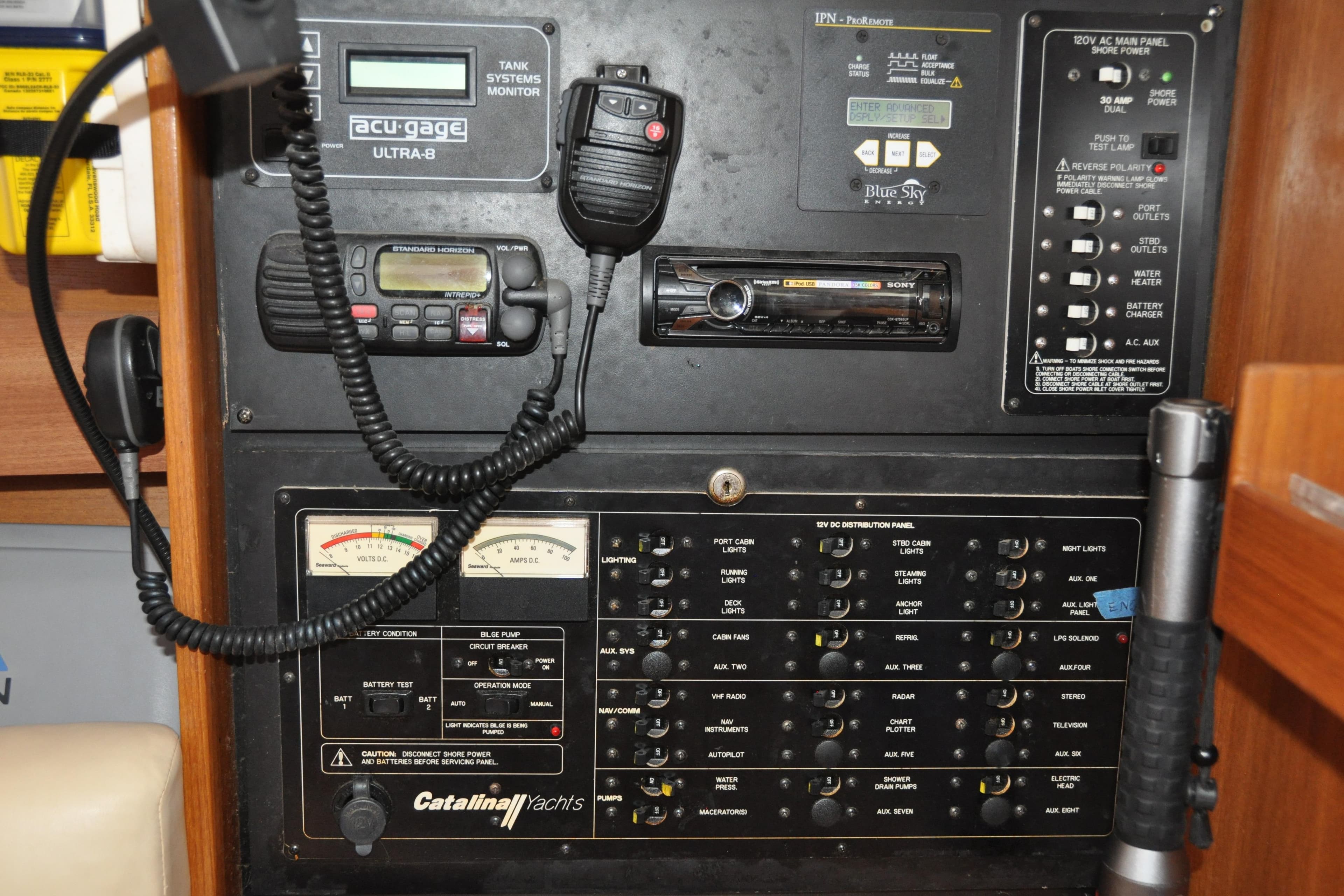 Control panel of a 2003 Catalina 387 yacht with various gauges and switches.