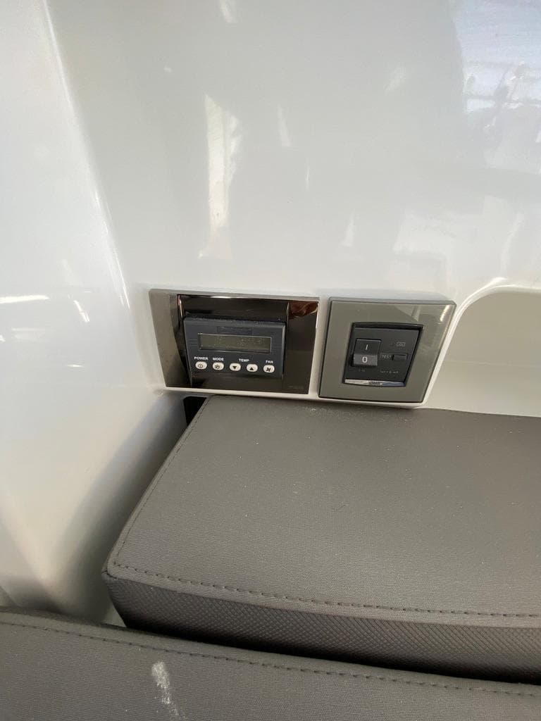 Control panel and switches inside a 2021 Beneteau Antares 23 boat.