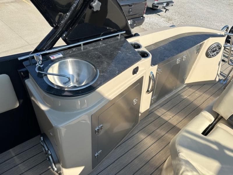 2025 Sylvan G-3 CLZ DC boat interior with sink and storage on deck.