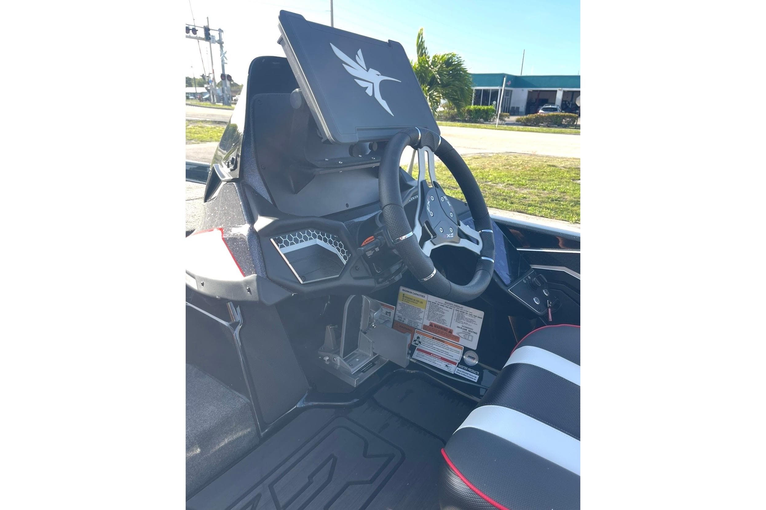 Interior of 2026 Skeeter FXR20 FLEX boat, featuring modern steering and dashboard design.