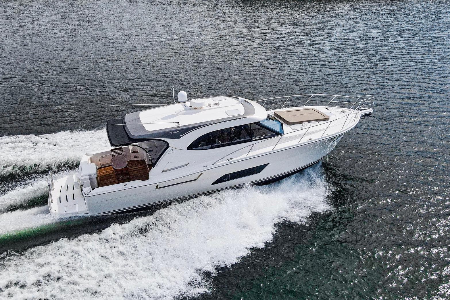 2016 Riviera 445 SUV cruising on open water, showcasing sleek design and performance.