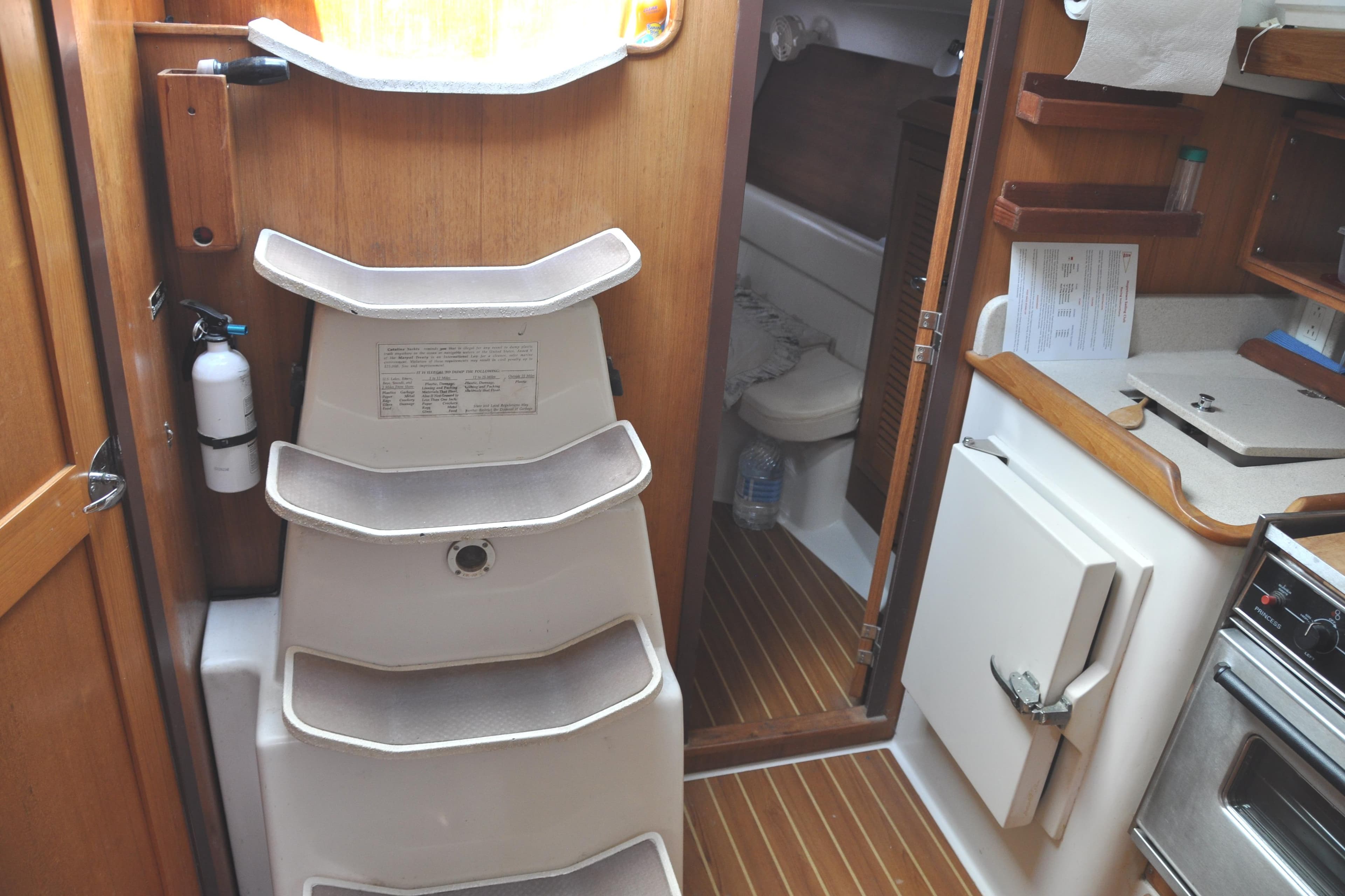 Interior of a 2003 Catalina 387 yacht with stairs and kitchen.