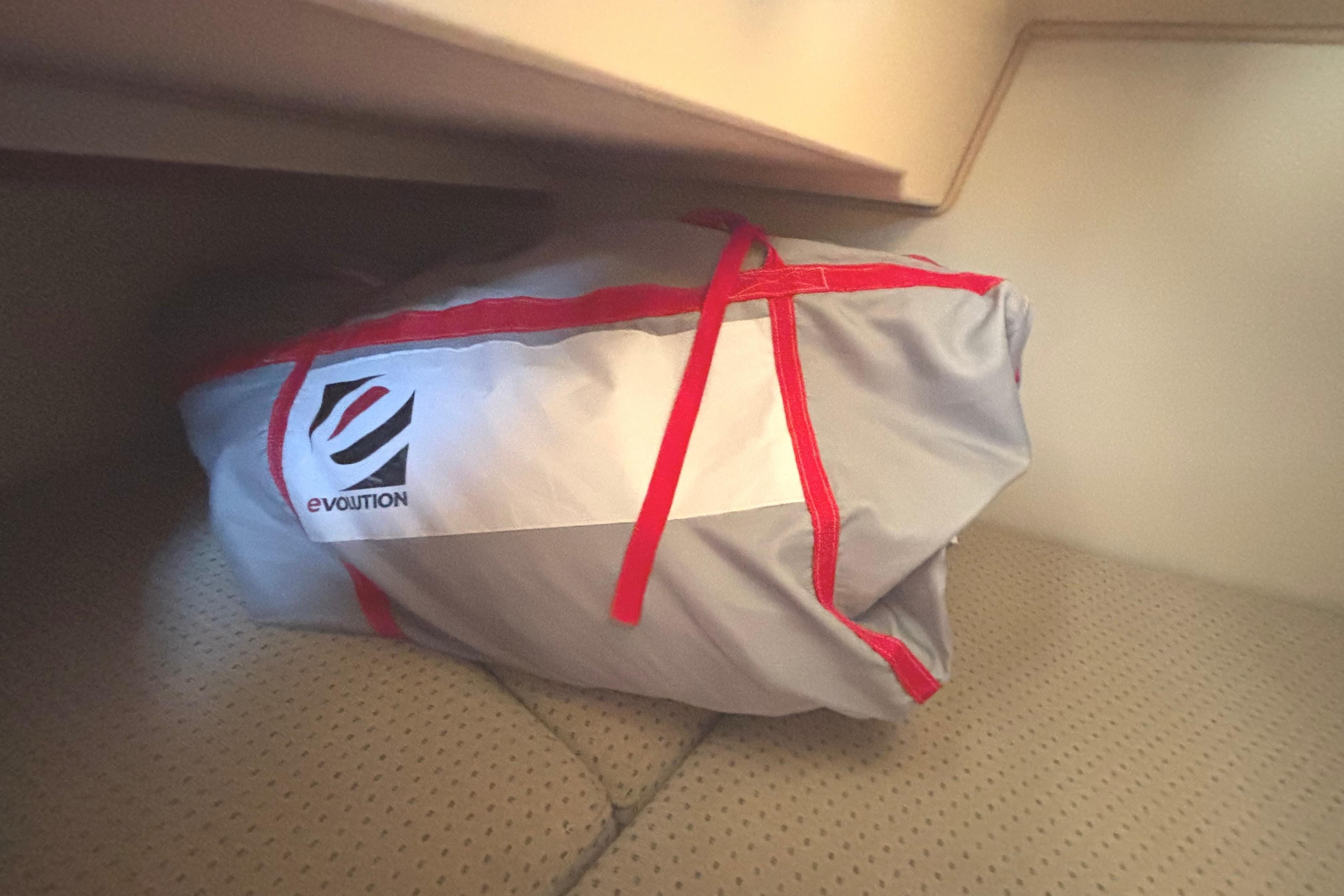 Bag with red straps in Island Packet 380 sailboat cabin, 2002 model.