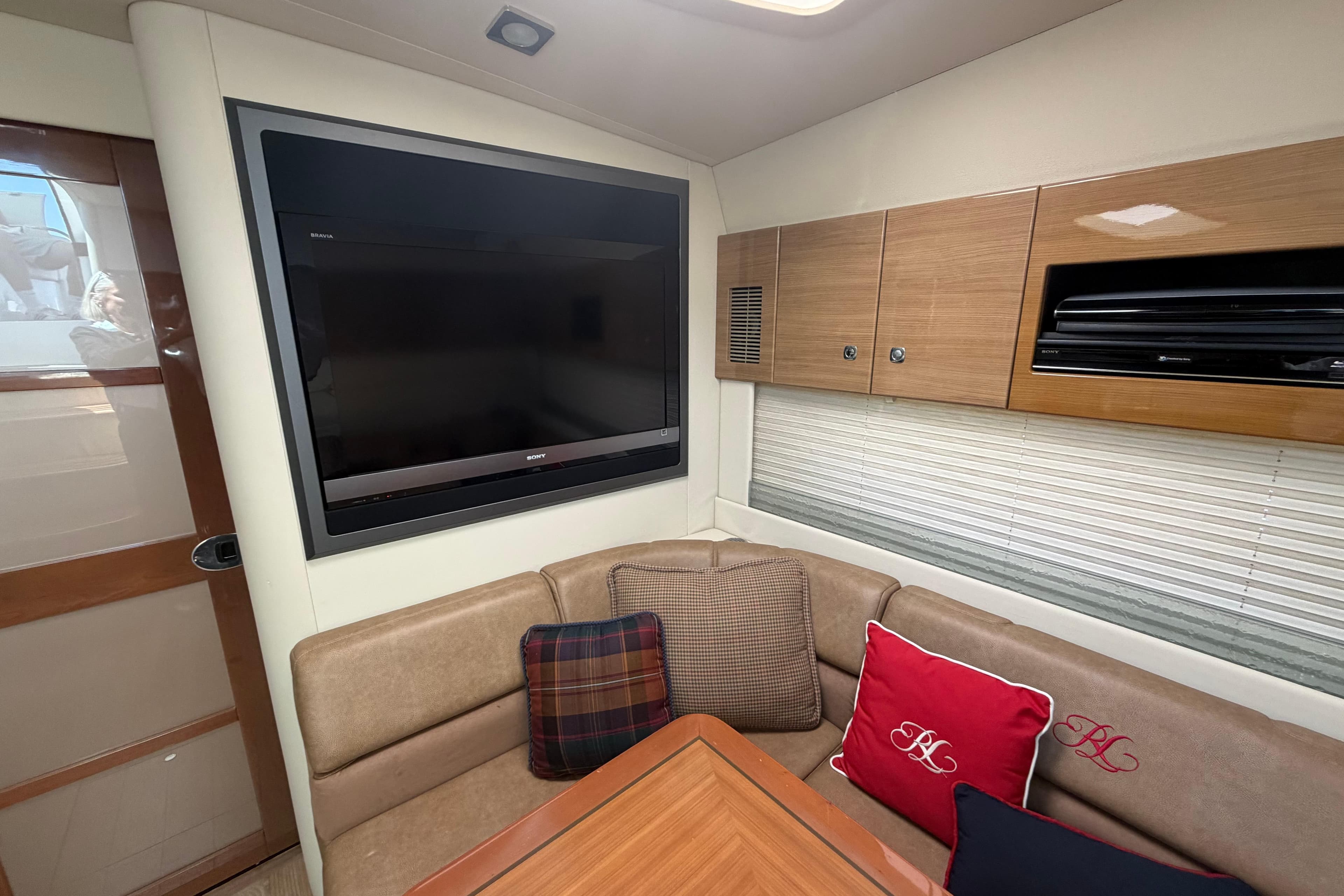 Luxurious interior of 2011 Formula 45 Yacht with TV and plush seating.