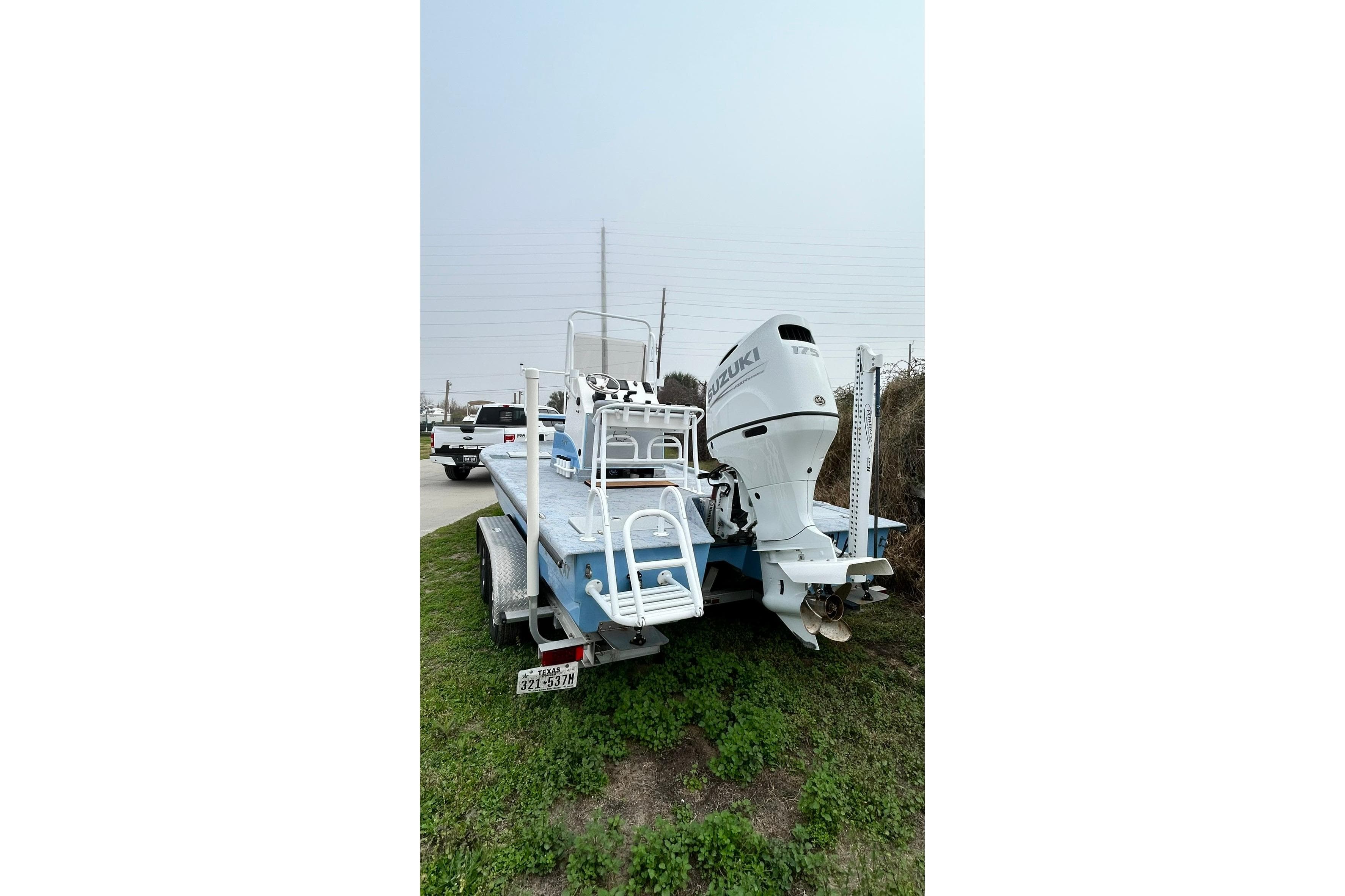 2022 Transcat 200 SVT boat with Suzuki outboard motor on trailer.