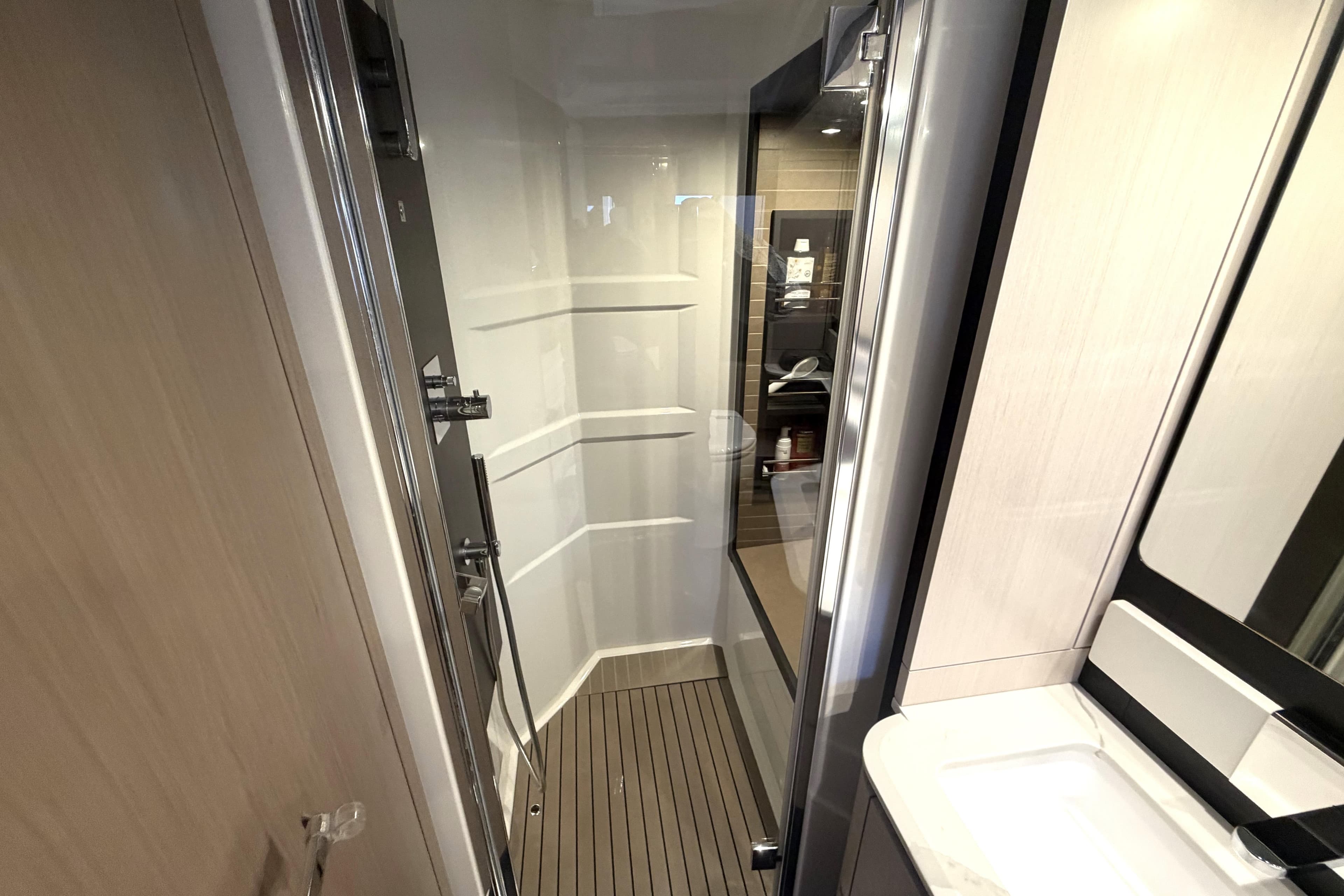 Luxurious bathroom interior of 2021 Azimut 66 yacht, featuring modern fixtures and sleek design.