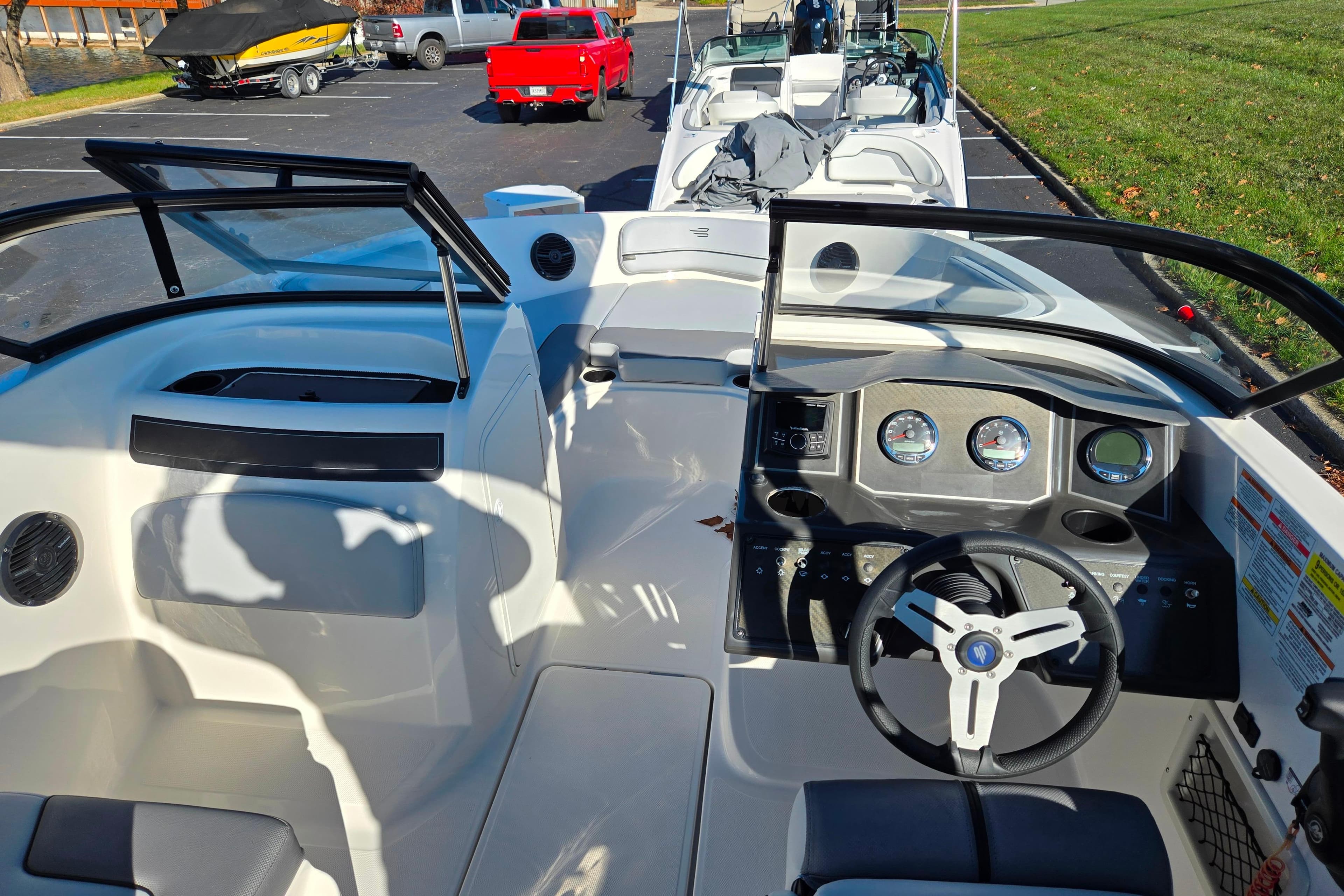 2024 Bayliner VR5 Bowrider OB interior with steering wheel and dashboard controls.