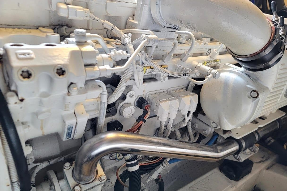Engine components of a 2014 Prestige 550 yacht, showcasing intricate mechanical details.