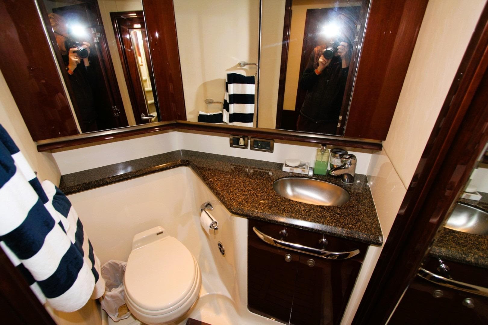 Luxurious bathroom in 2007 Sea Ray 580 Sedan Bridge yacht with modern fixtures.