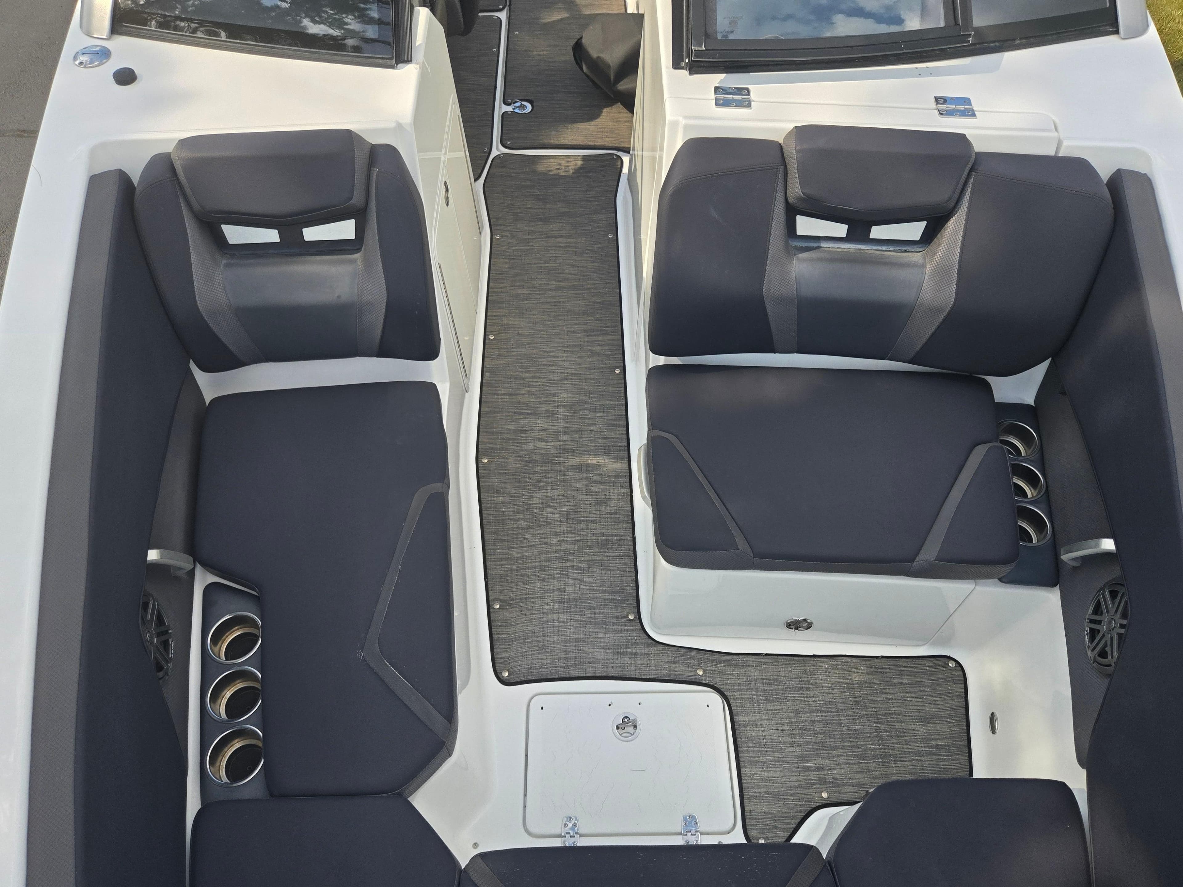 2021 Scarab 285 ID boat interior with black seating and cup holders.