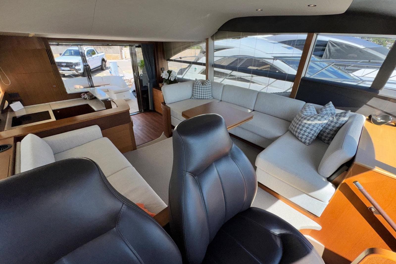 Luxurious interior of a 2015 Princess 52 yacht with elegant seating and modern design.