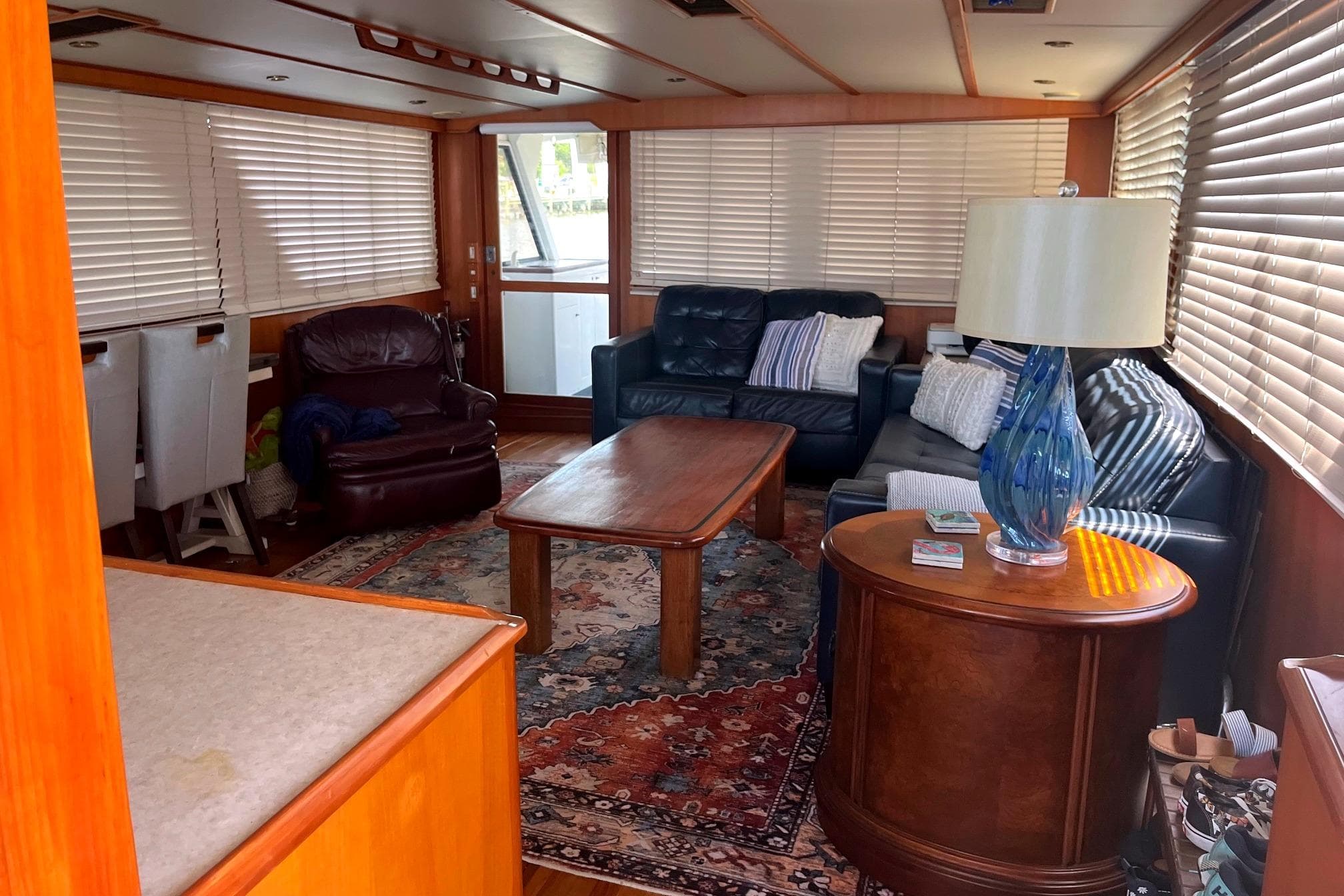 Luxurious interior of a 1999 Jefferson Marquessa 56 yacht with cozy seating and elegant decor.
