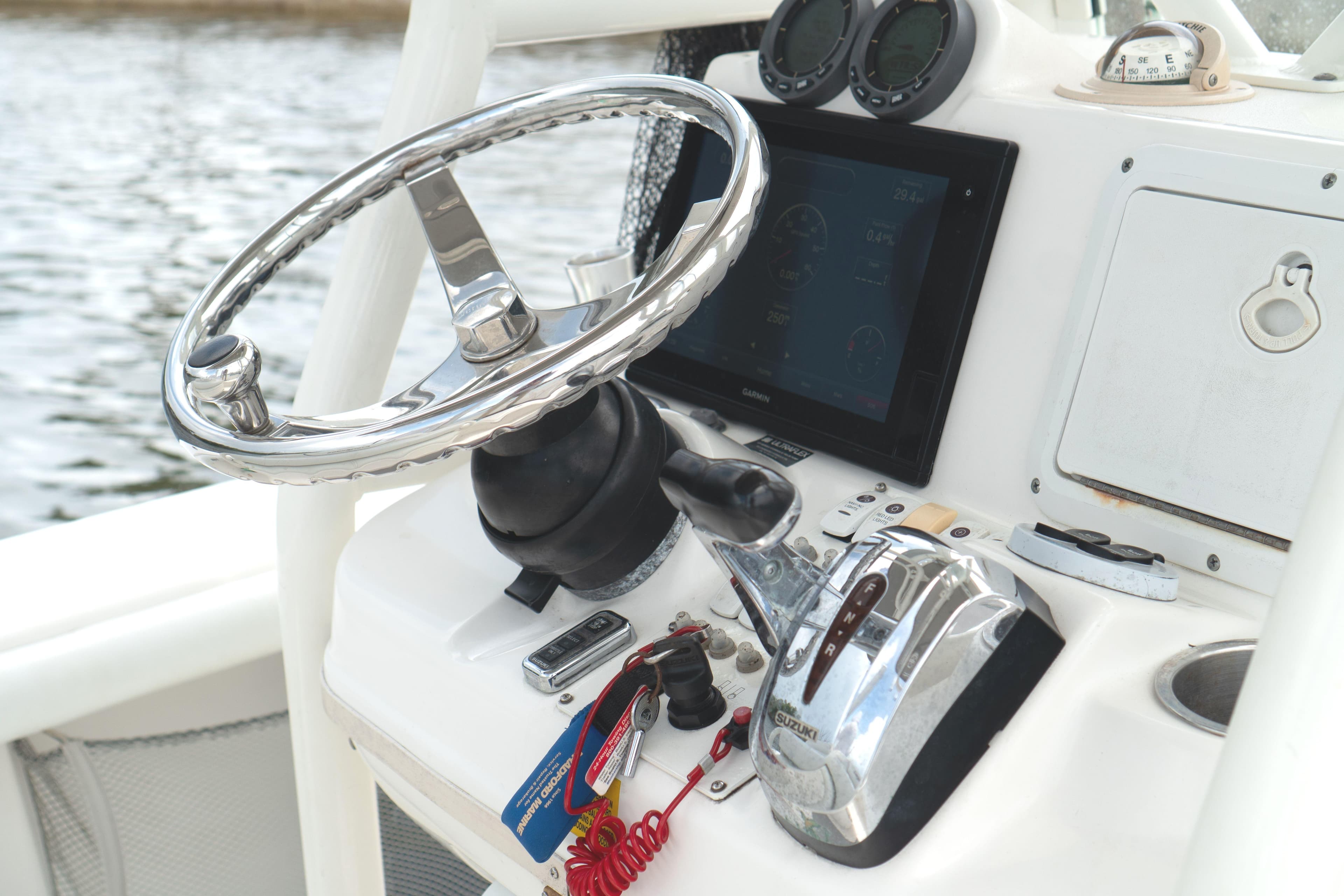 Steering console of 2007 Everglades 243 Center Console boat with modern controls.