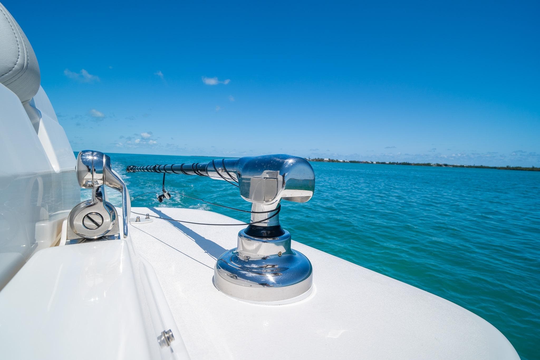 2025 SeaVee 322Z boat on clear blue water, showcasing sleek design and chrome details.