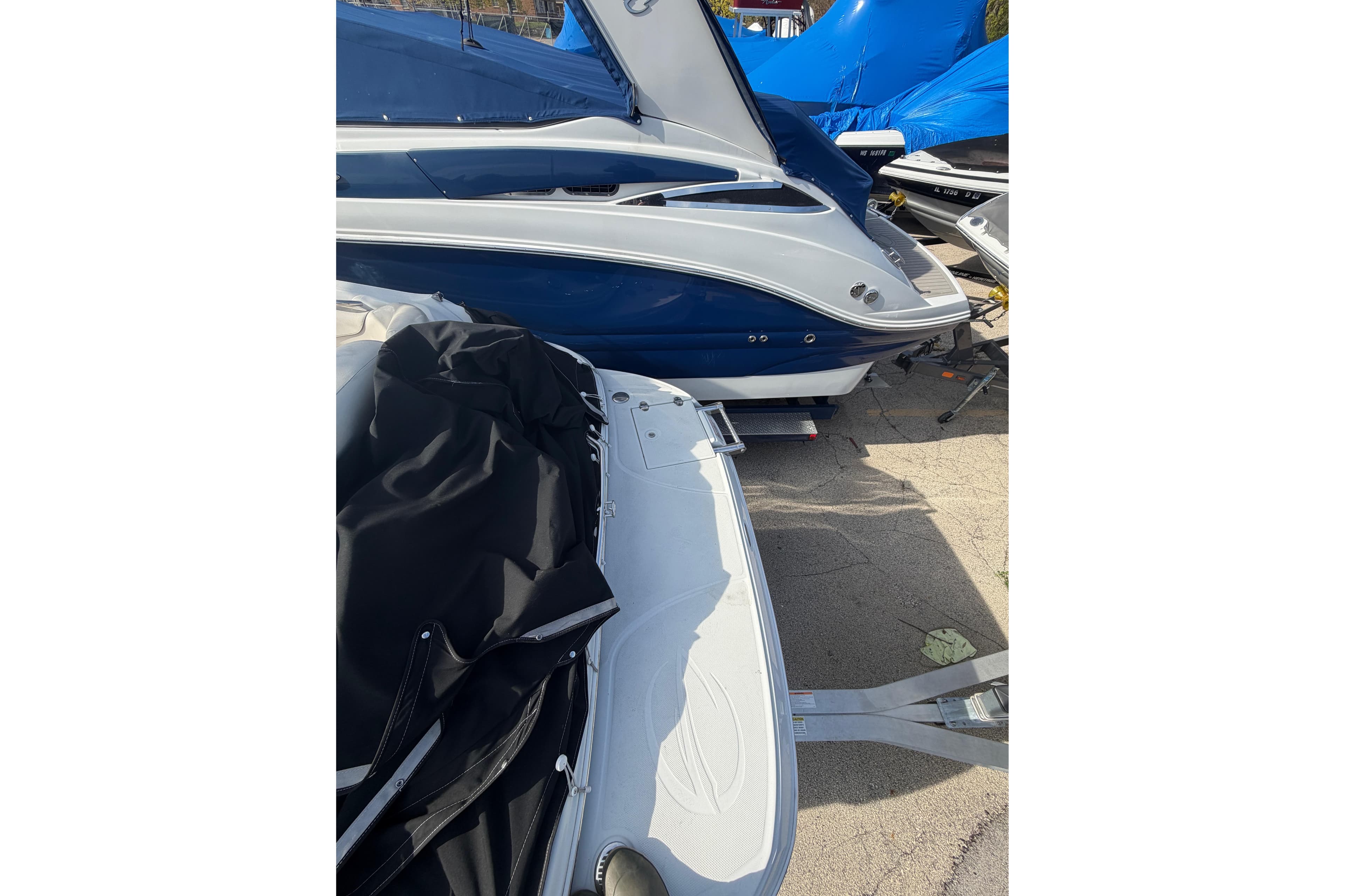 2020 Crownline 286 SC boat with blue and white exterior, parked on a trailer.