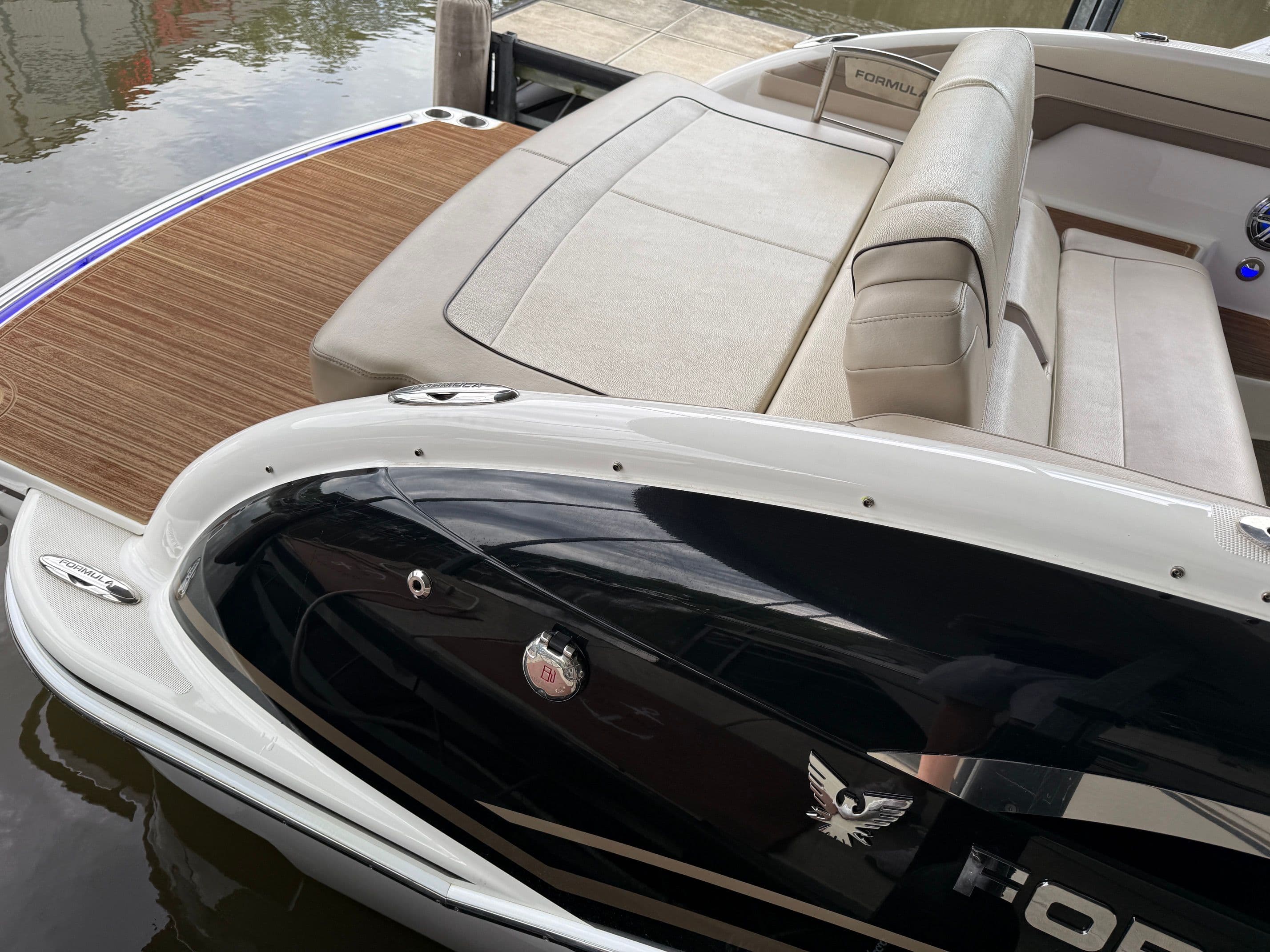 2016 Formula 310 BR boat with sleek interior by the water.