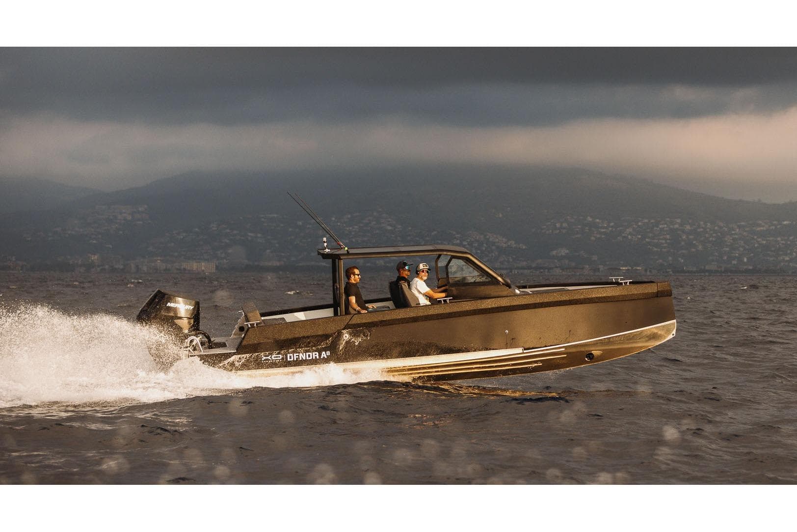 Sleek 2027 XO DFNDR A8 boat cruising on open water under cloudy skies.