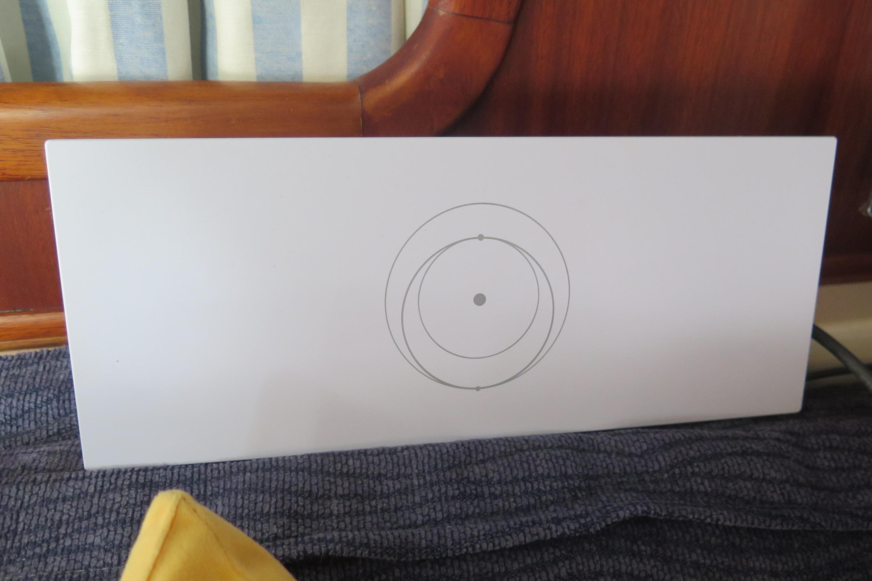 White panel with circular design, Simpson Inspiration 1996 model, on a wooden surface.