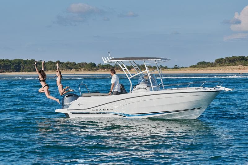 2024 Jeanneau Leader 6.5 CC Series 3 boat with people enjoying a sunny day on the water.