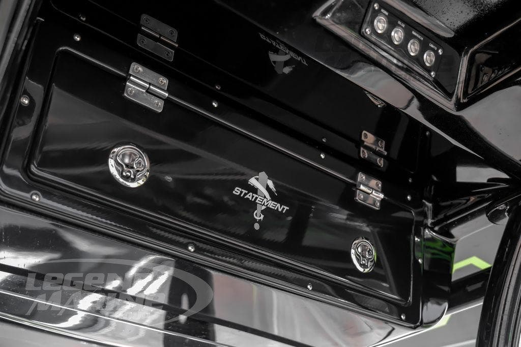 2024 Statement 350 Open boat interior with sleek black storage compartment.