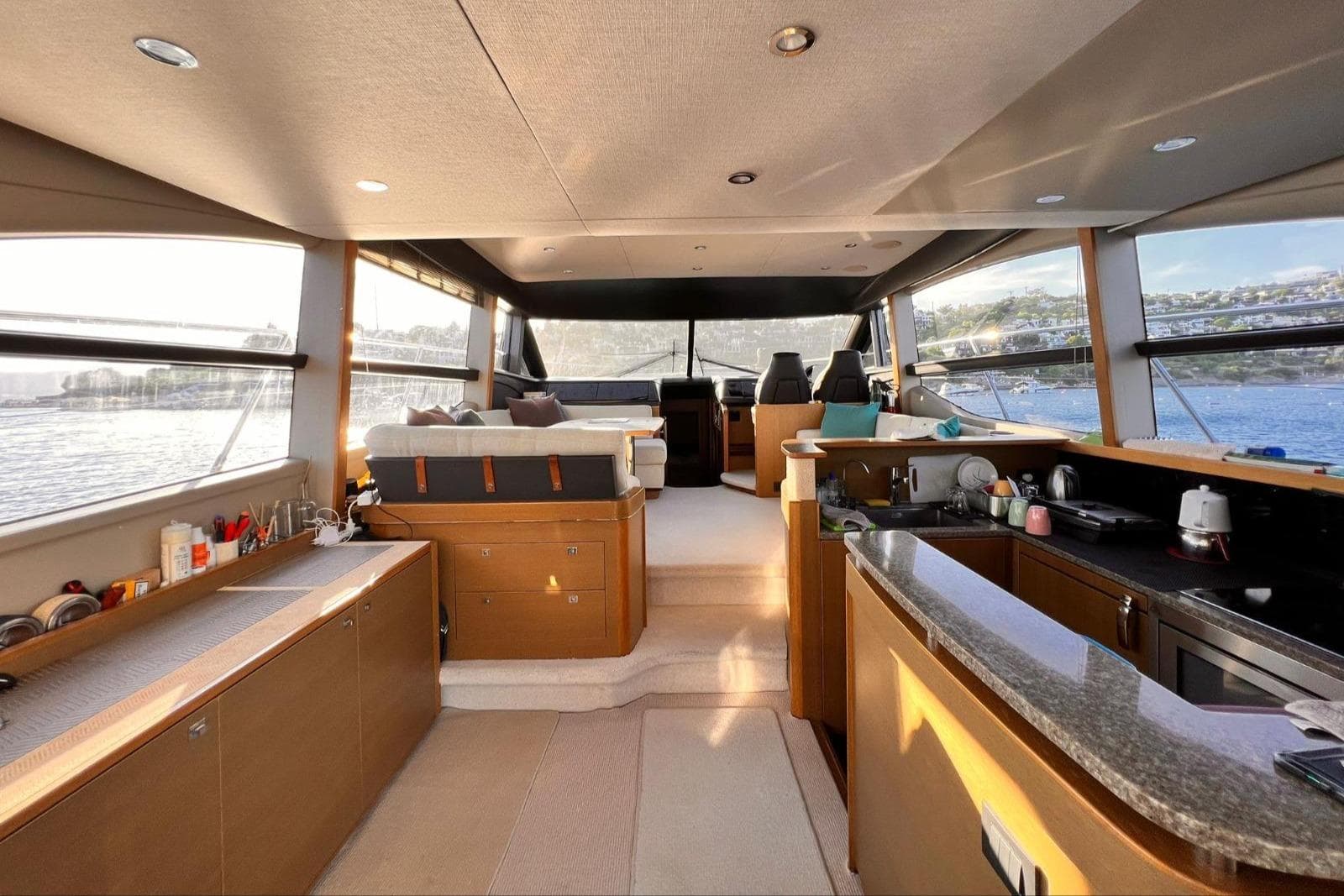 Luxurious interior of a 2014 Princess 52 yacht with panoramic windows and modern amenities.
