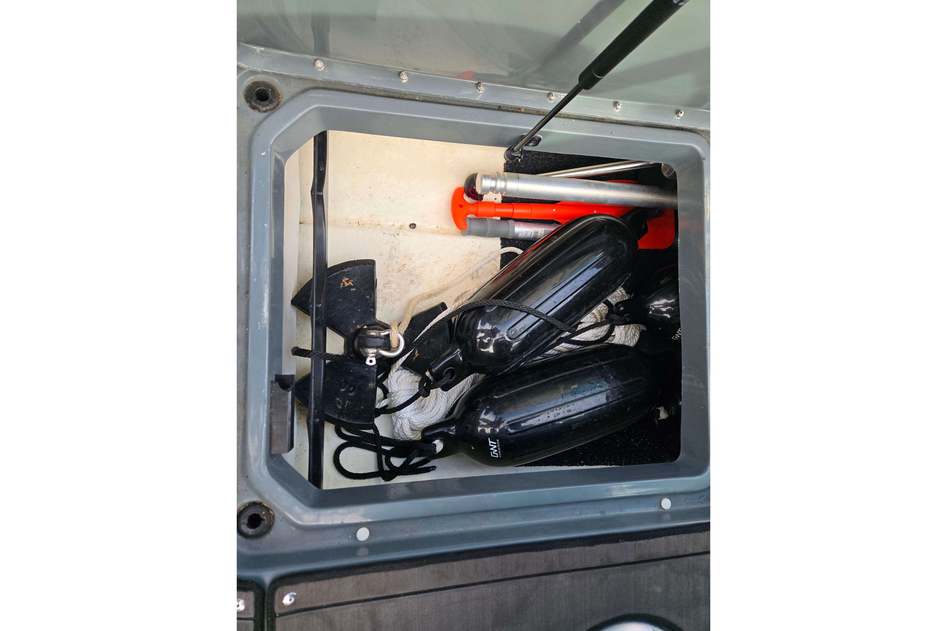 Storage compartment of 2020 Lund 189 Tyee GL boat with equipment and accessories.