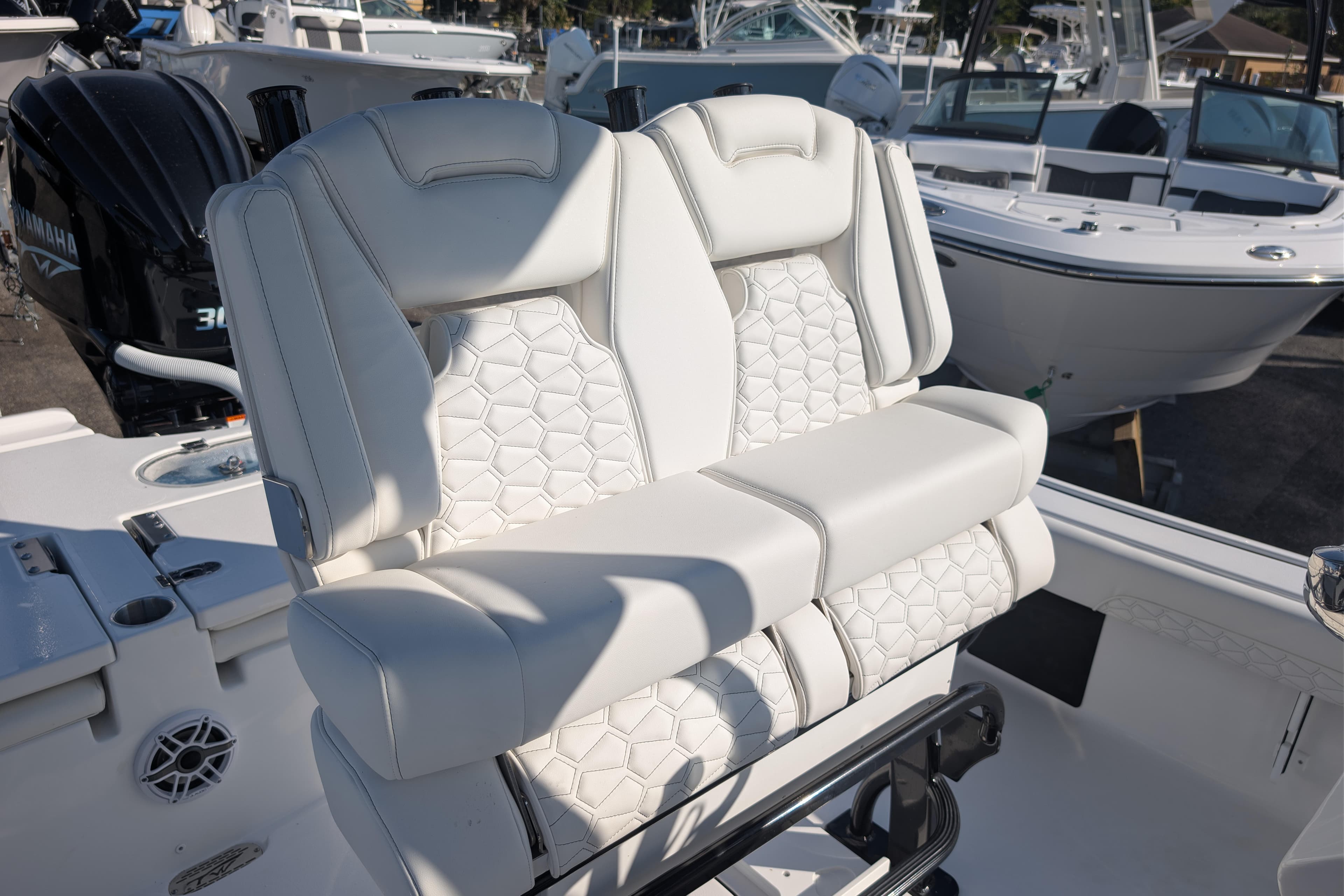 2026 Tidewater 2500 Carolina Bay boat with luxurious white seating and Yamaha engine.