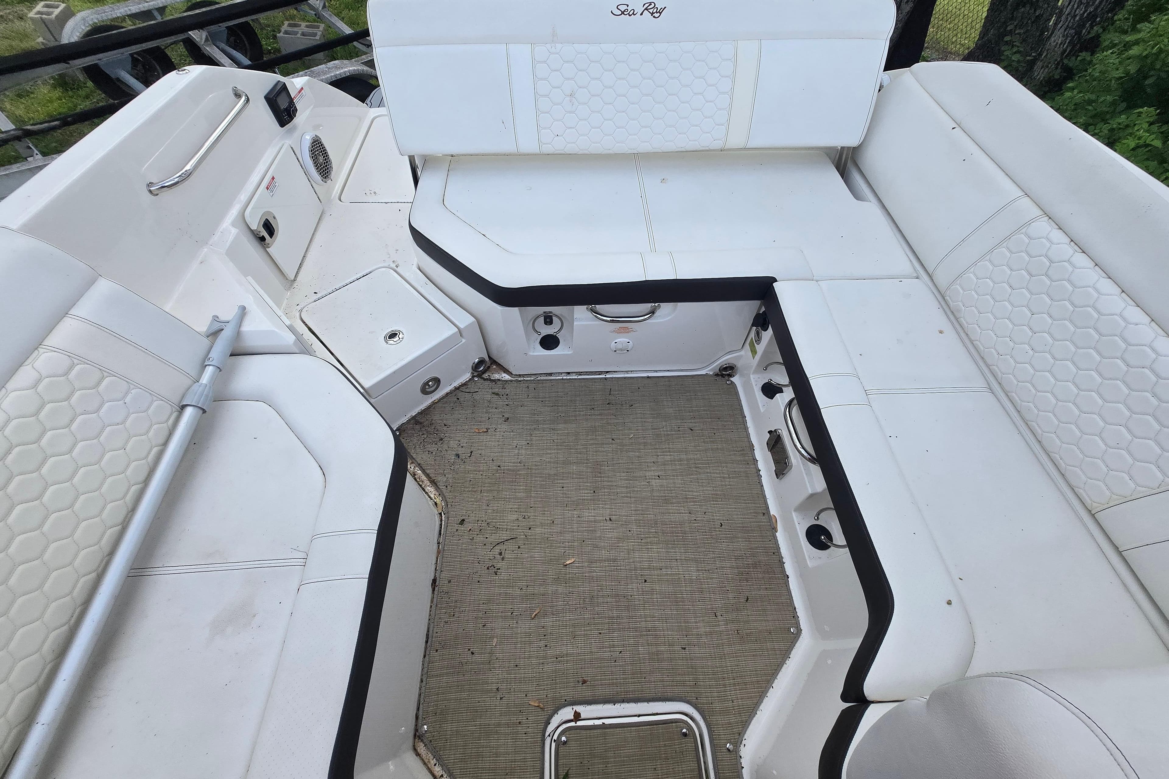 Interior seating area of a 2018 Sea Ray SDX 250 boat, featuring white upholstery.