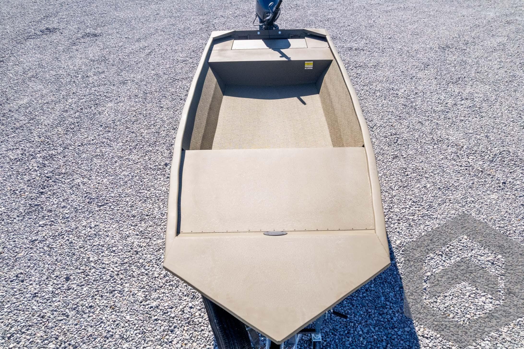 2026 G3 1652 VBW boat on gravel, top view, beige interior.