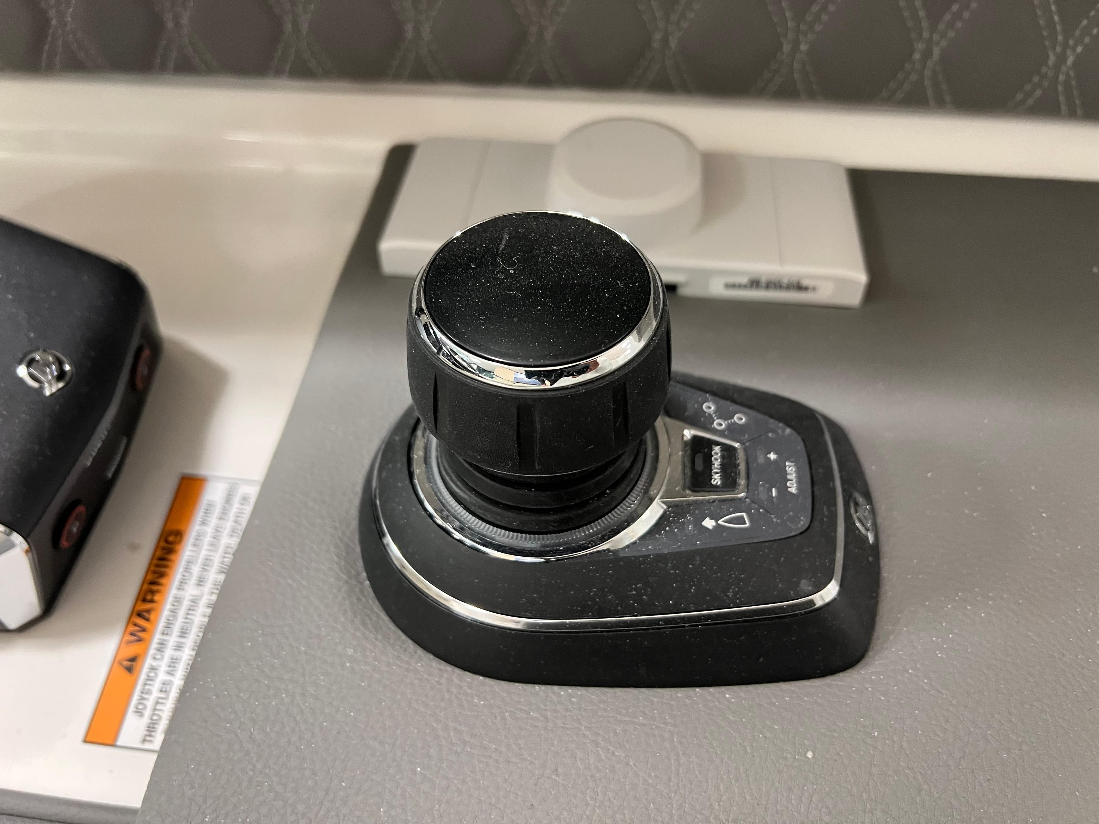 Joystick control on 2025 Sea Ray SLX 310 boat dashboard.