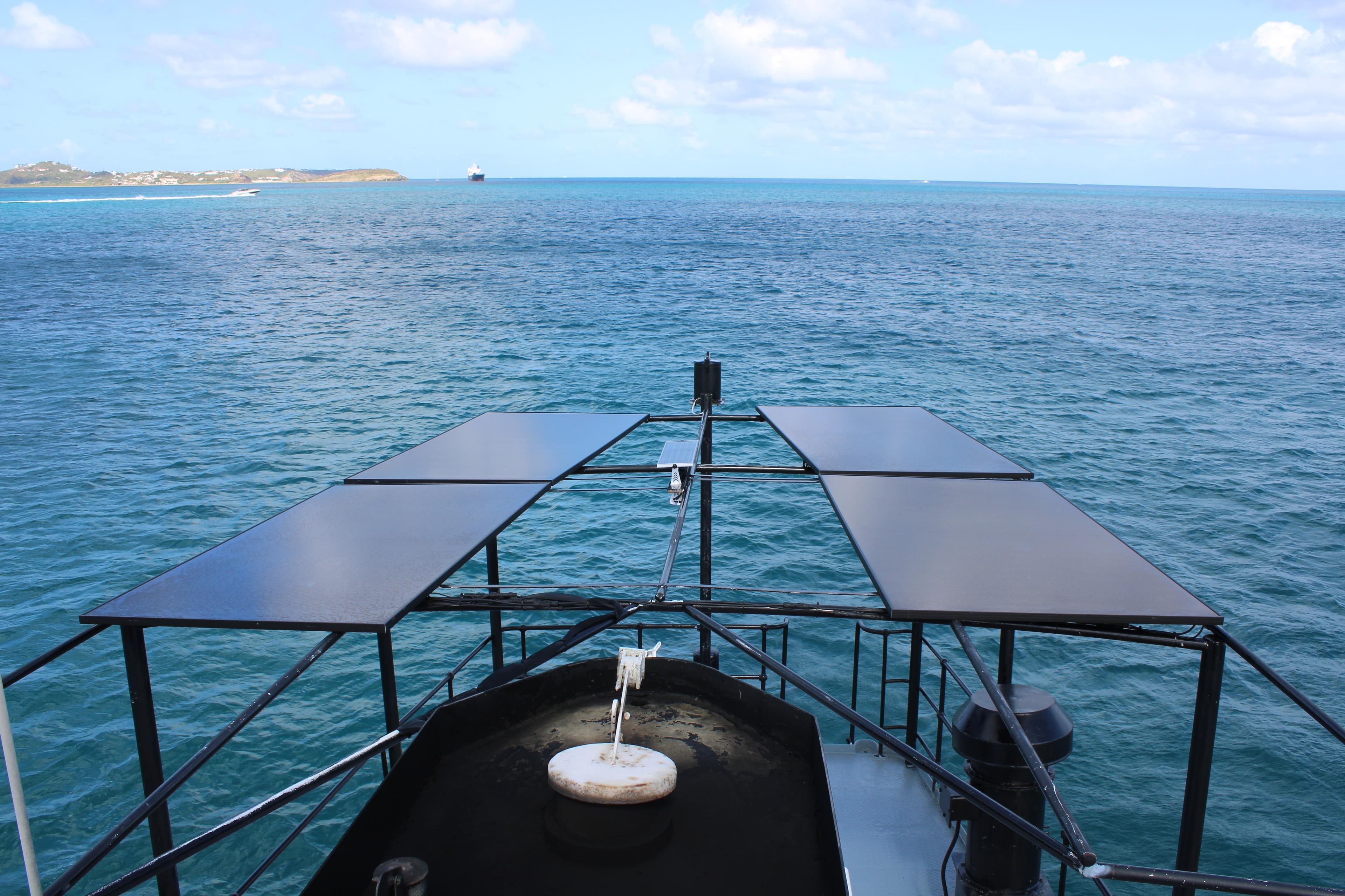 Custom 1970 CD Holmes Clovelly Class Tender Fleet on ocean with solar panels.