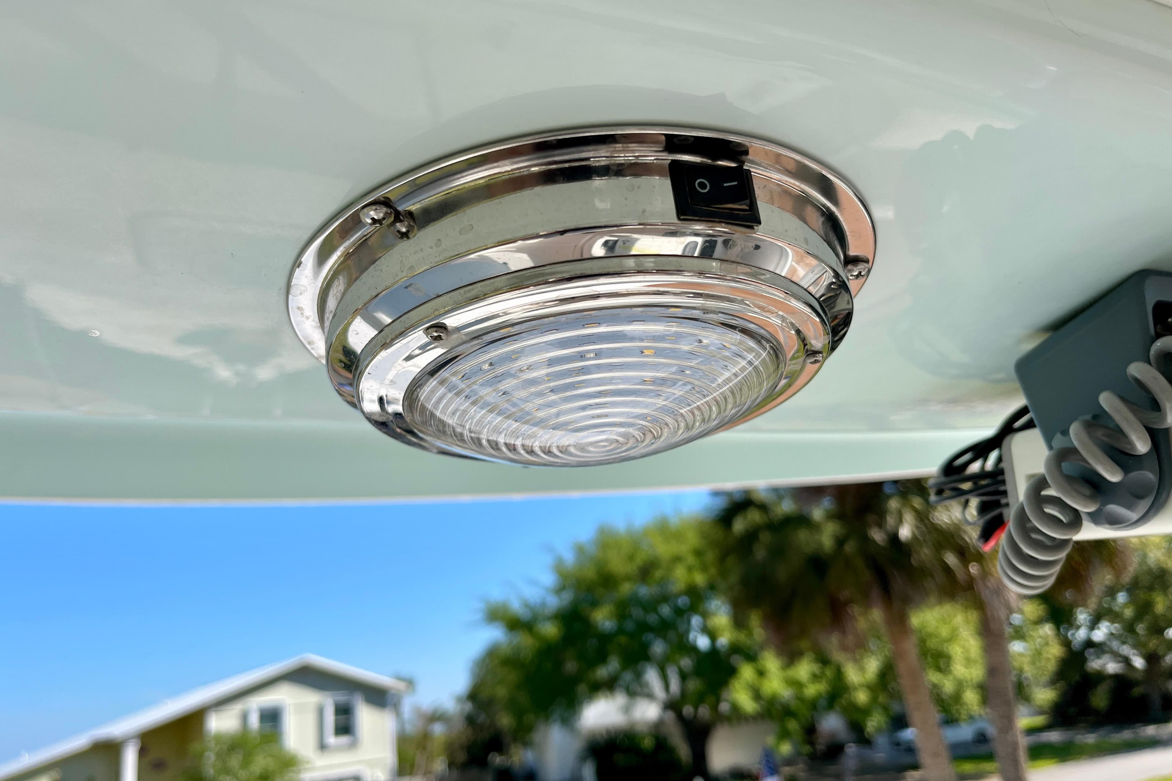 2018 Pro-Line 26 Express boat light fixture, chrome finish, outdoor setting.
