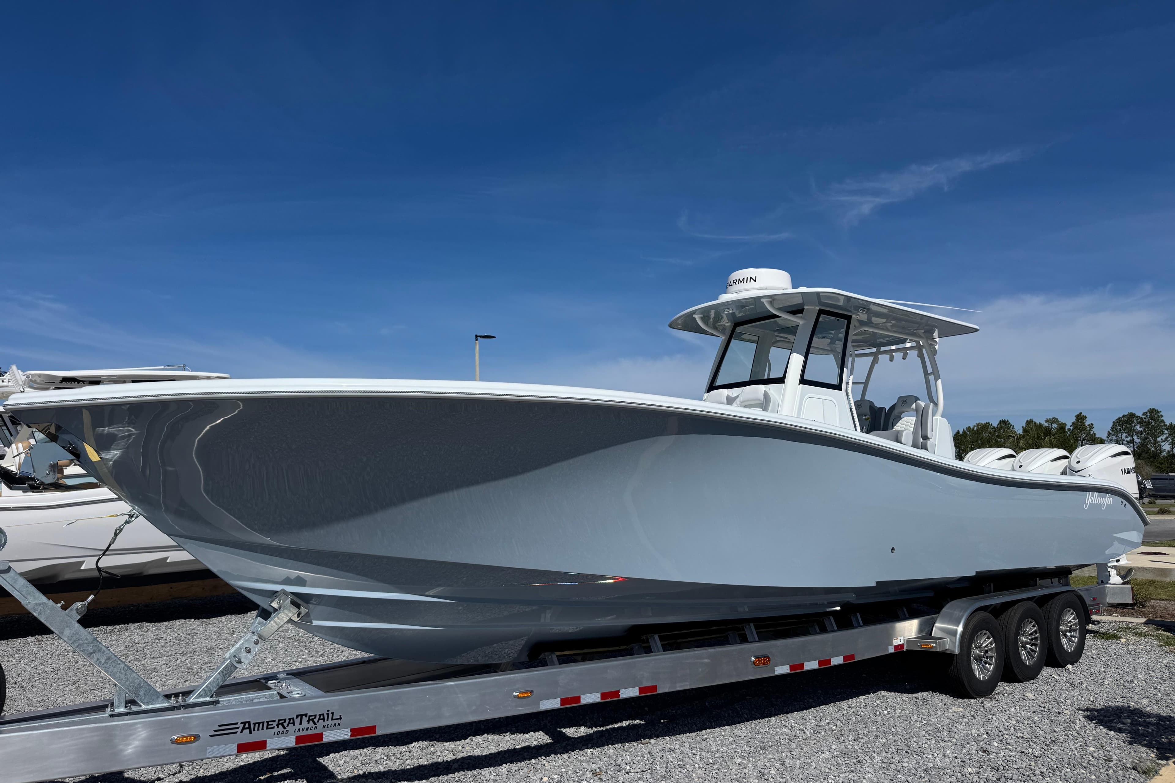 2026 Yellowfin 36 Offshore boat on trailer under clear blue sky.